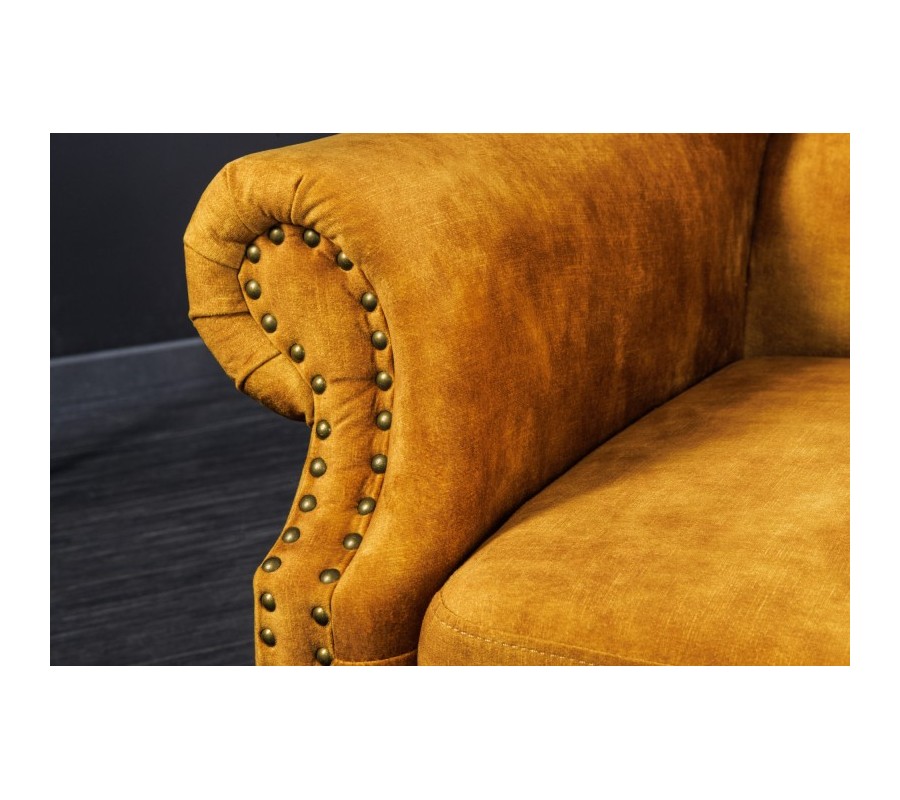 Chesterfield armchair Cella with velvet upholstery in mustard yellow with dark brown solid legs 105cm