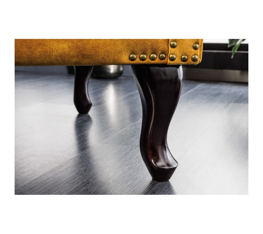 Chesterfield armchair Cella with velvet upholstery in mustard yellow with dark brown solid legs 105cm