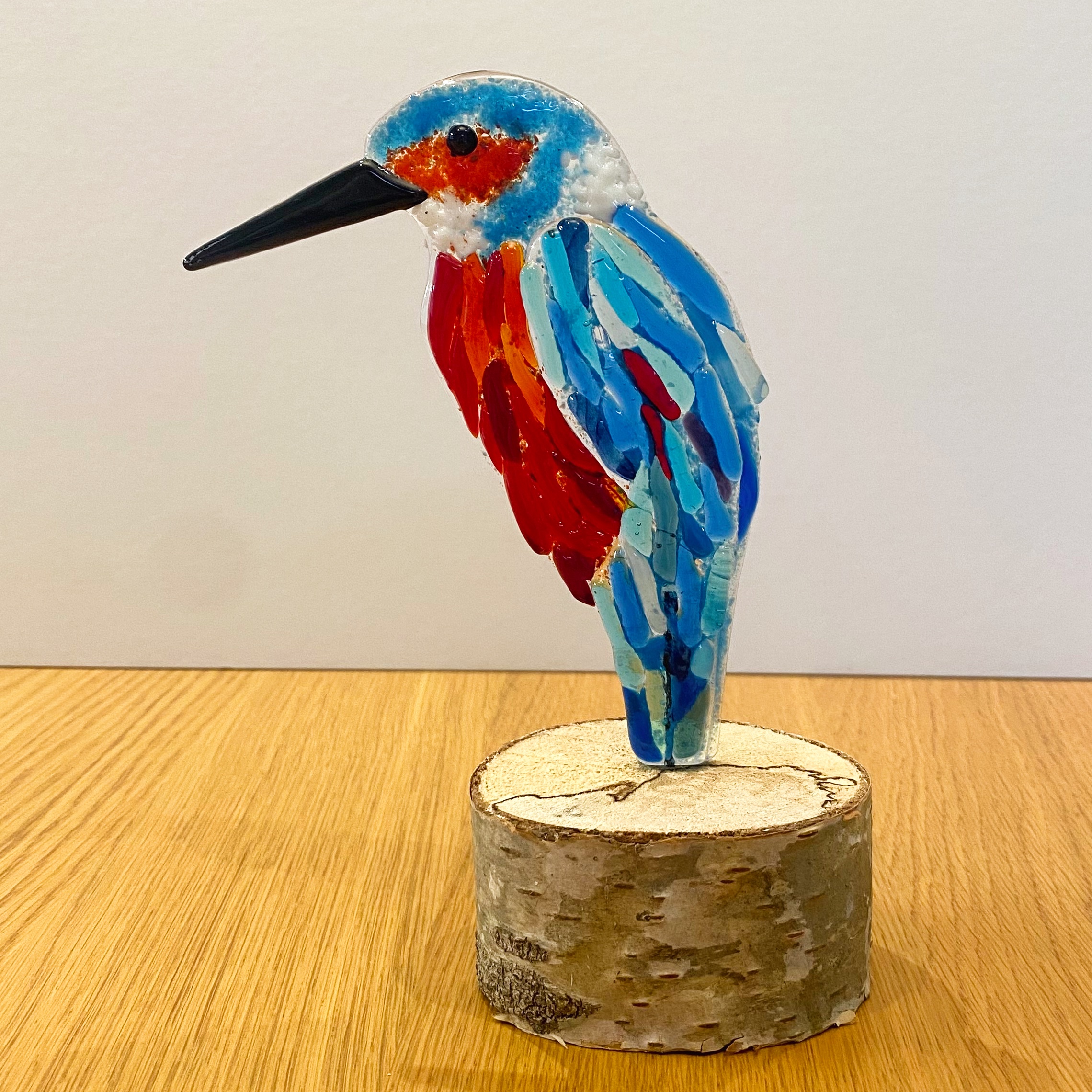 Kingfisher on wooden log