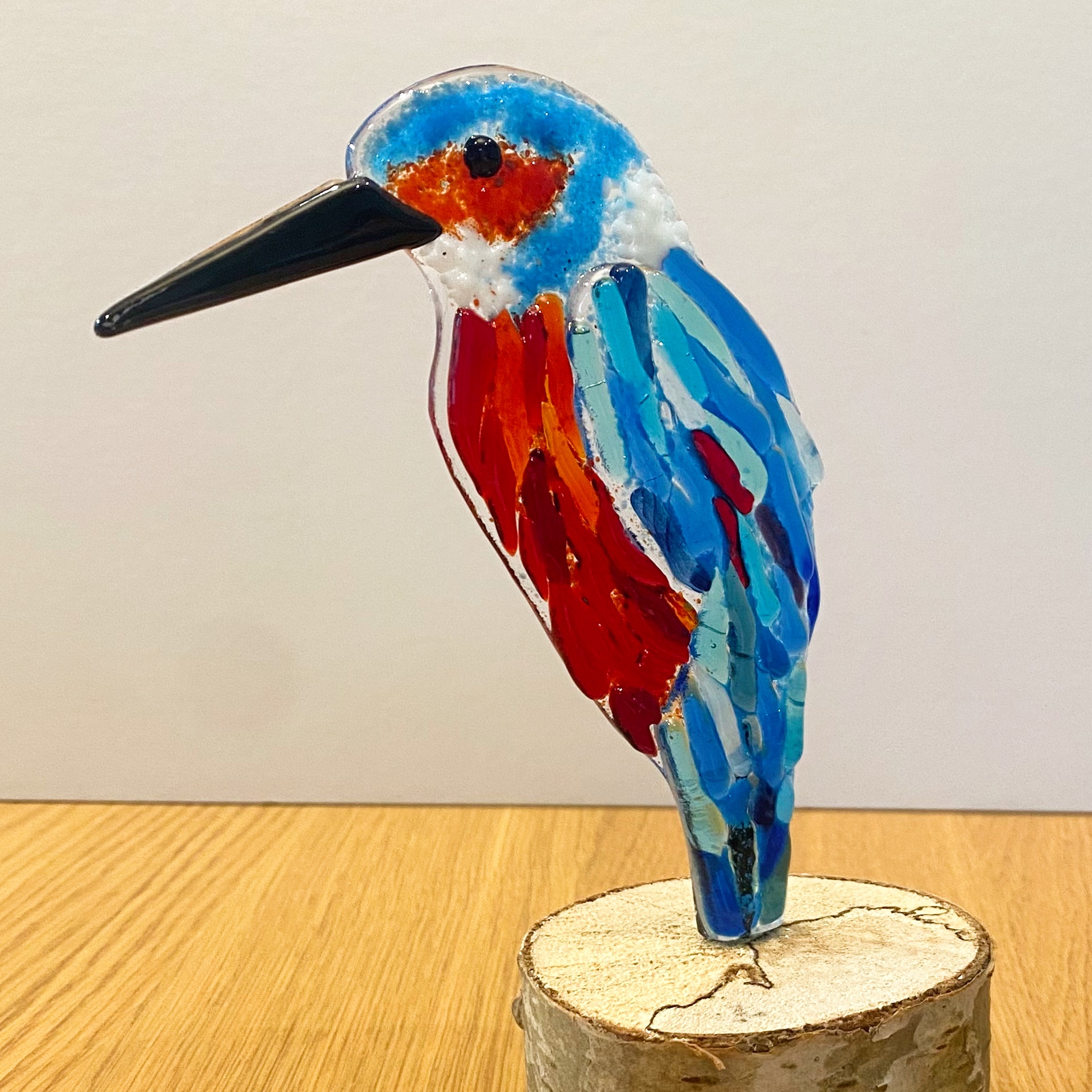 Kingfisher on wooden log