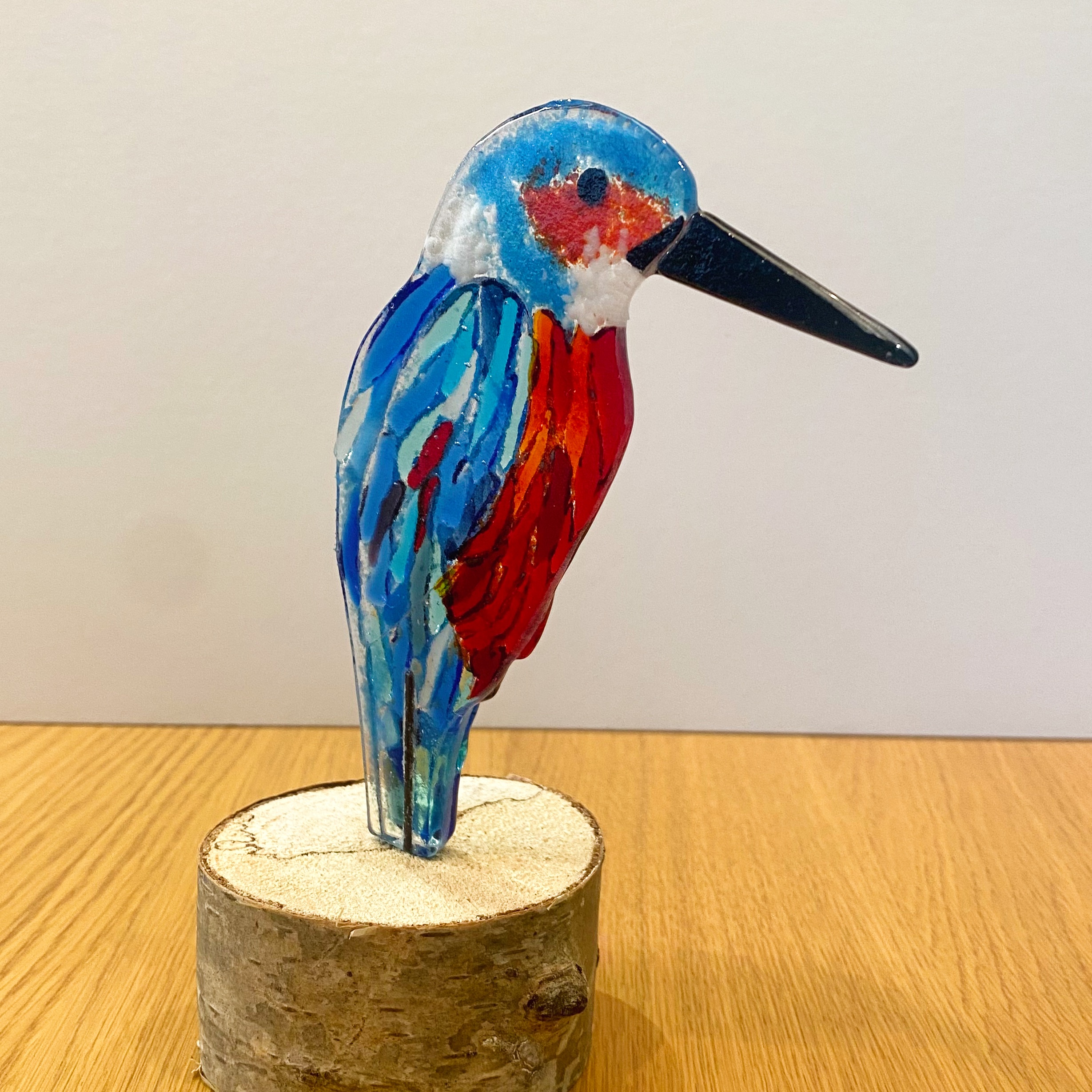 Kingfisher on wooden log