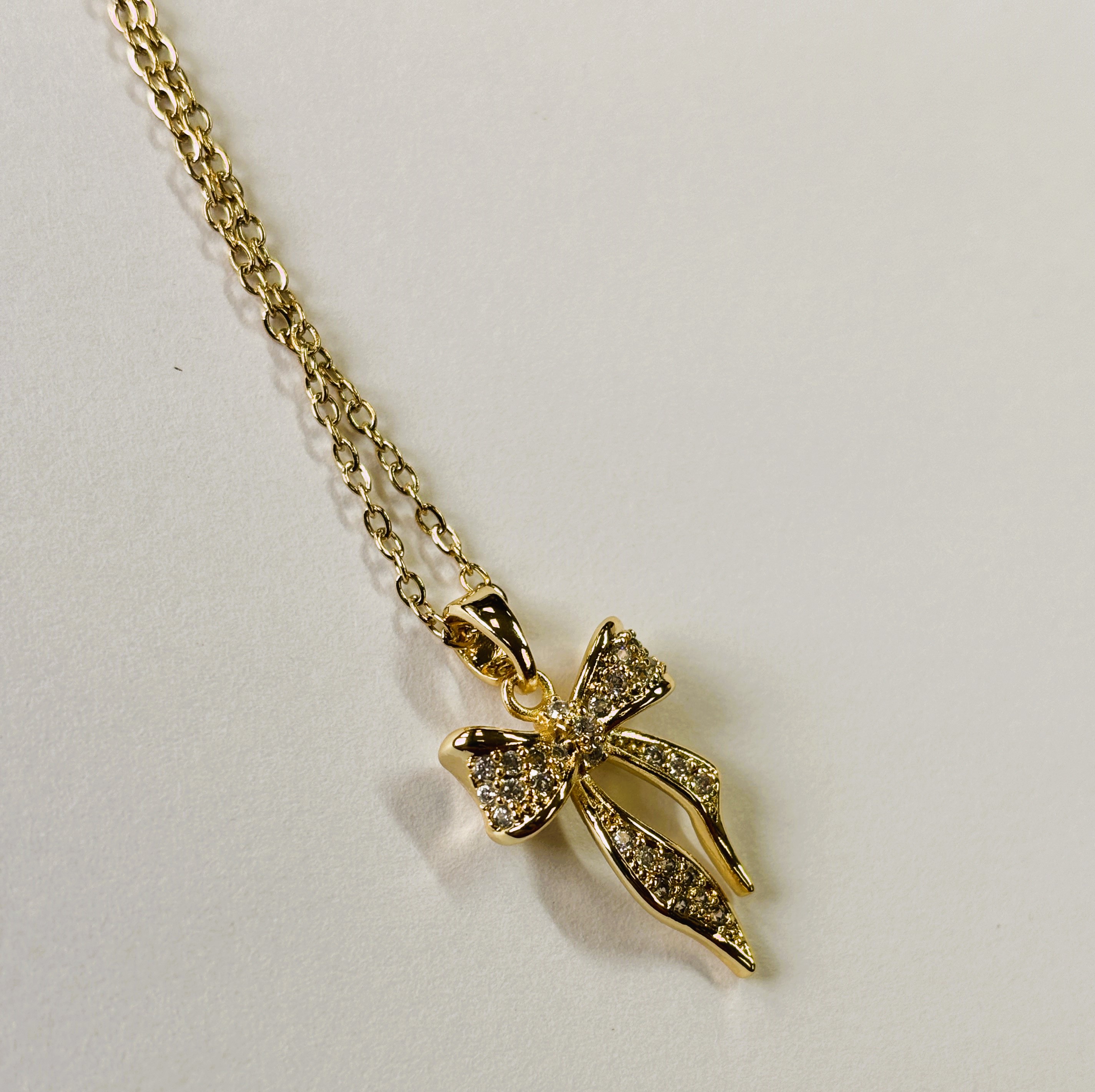 Large Gold Bow Pendant Necklace with Zircon Sand Coat