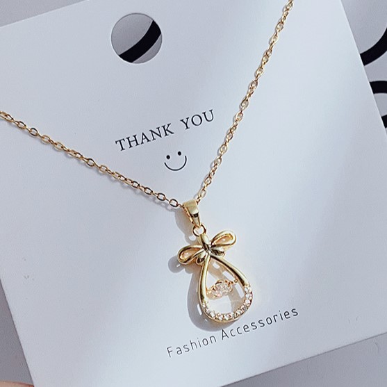 Gold Goodie Bag with Round Cut Zircon Floater Pendant Necklace