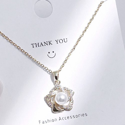 Gold Spinning Star with Pearl and Sand Zircon Pendant Necklace