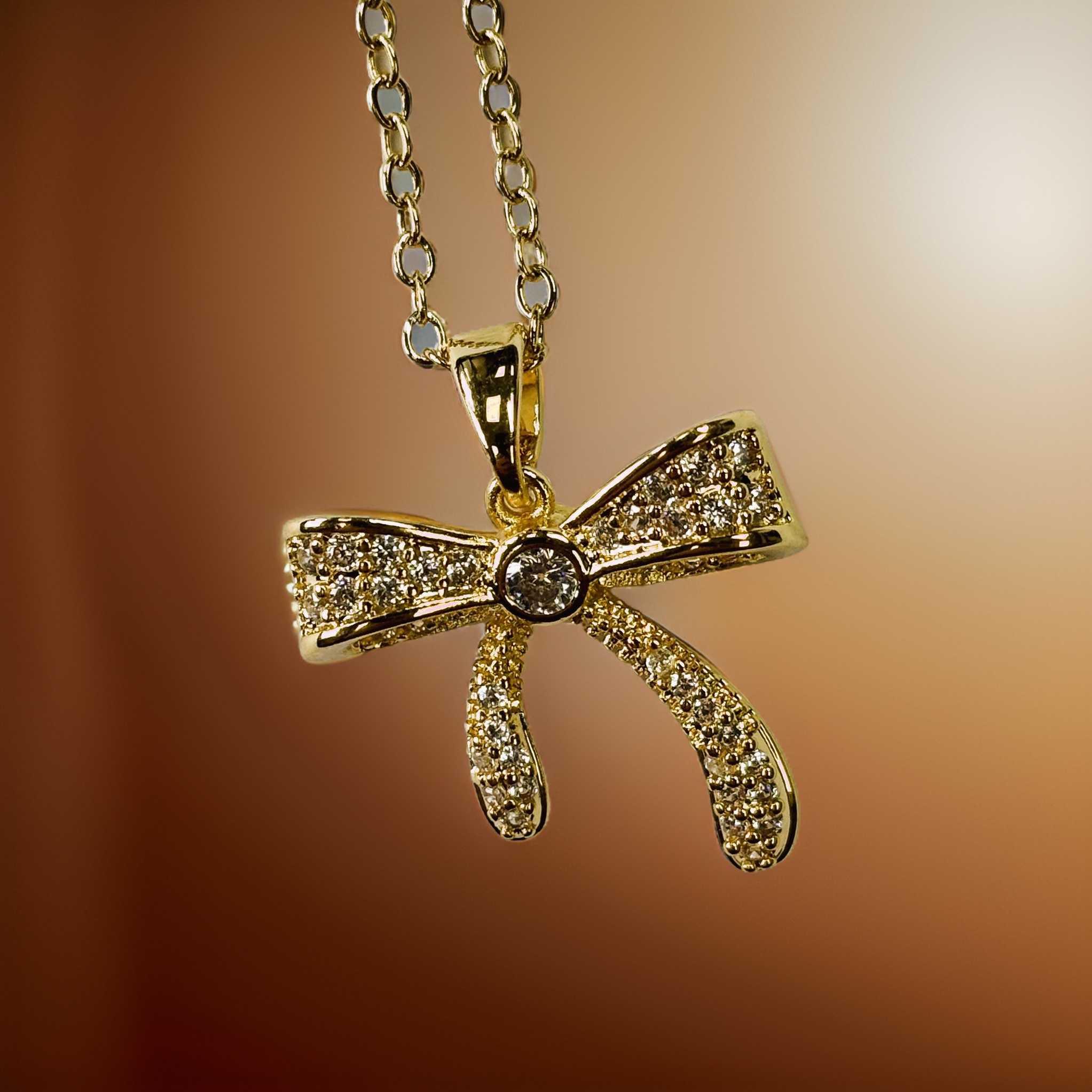 Gold Relief Zircon Sand Gift Bow Pendant Necklace