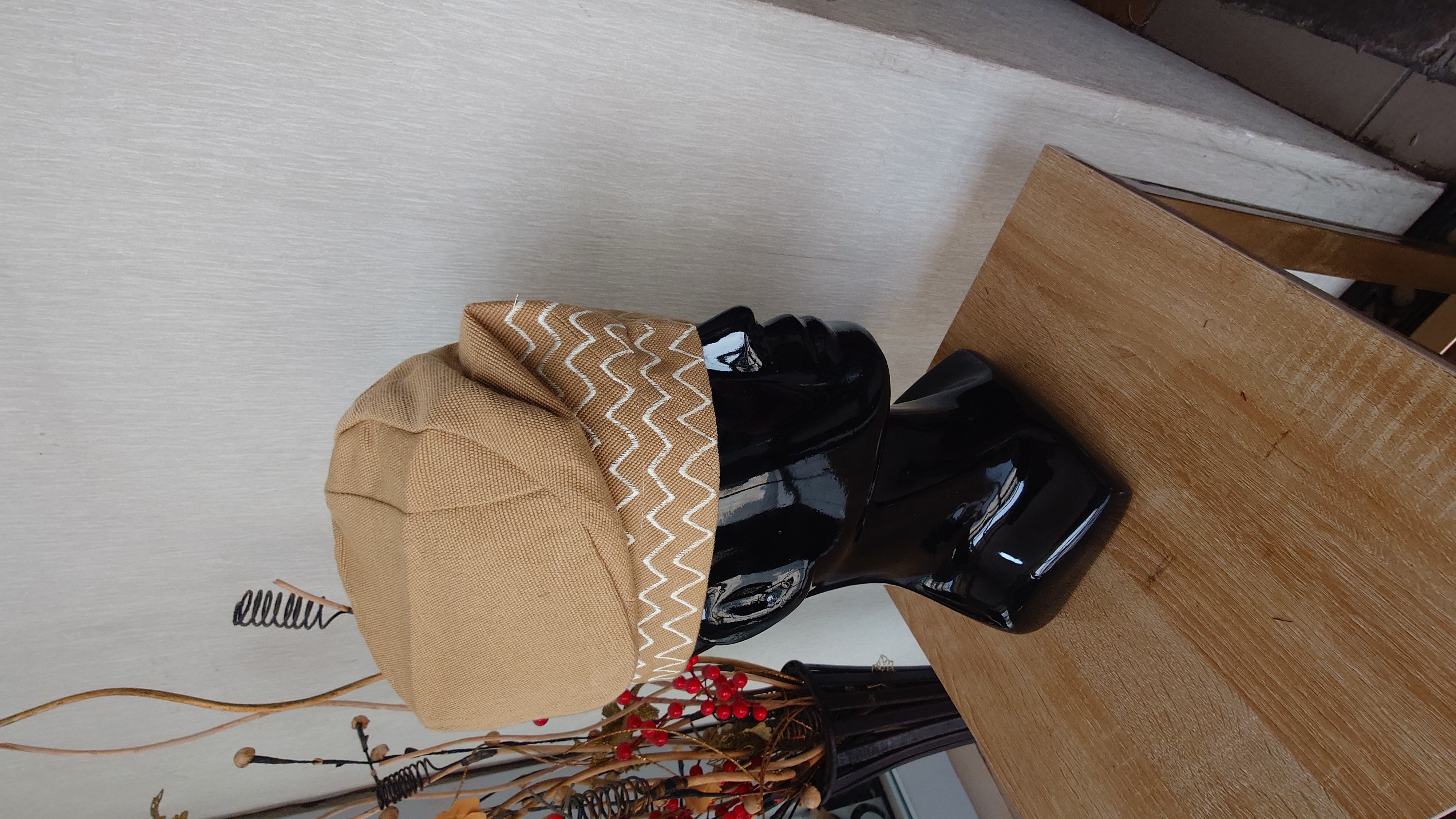 Handwoven plain  carton/beige asoke with white zigzag embroidery   It's neatly tailored and fully lined.  