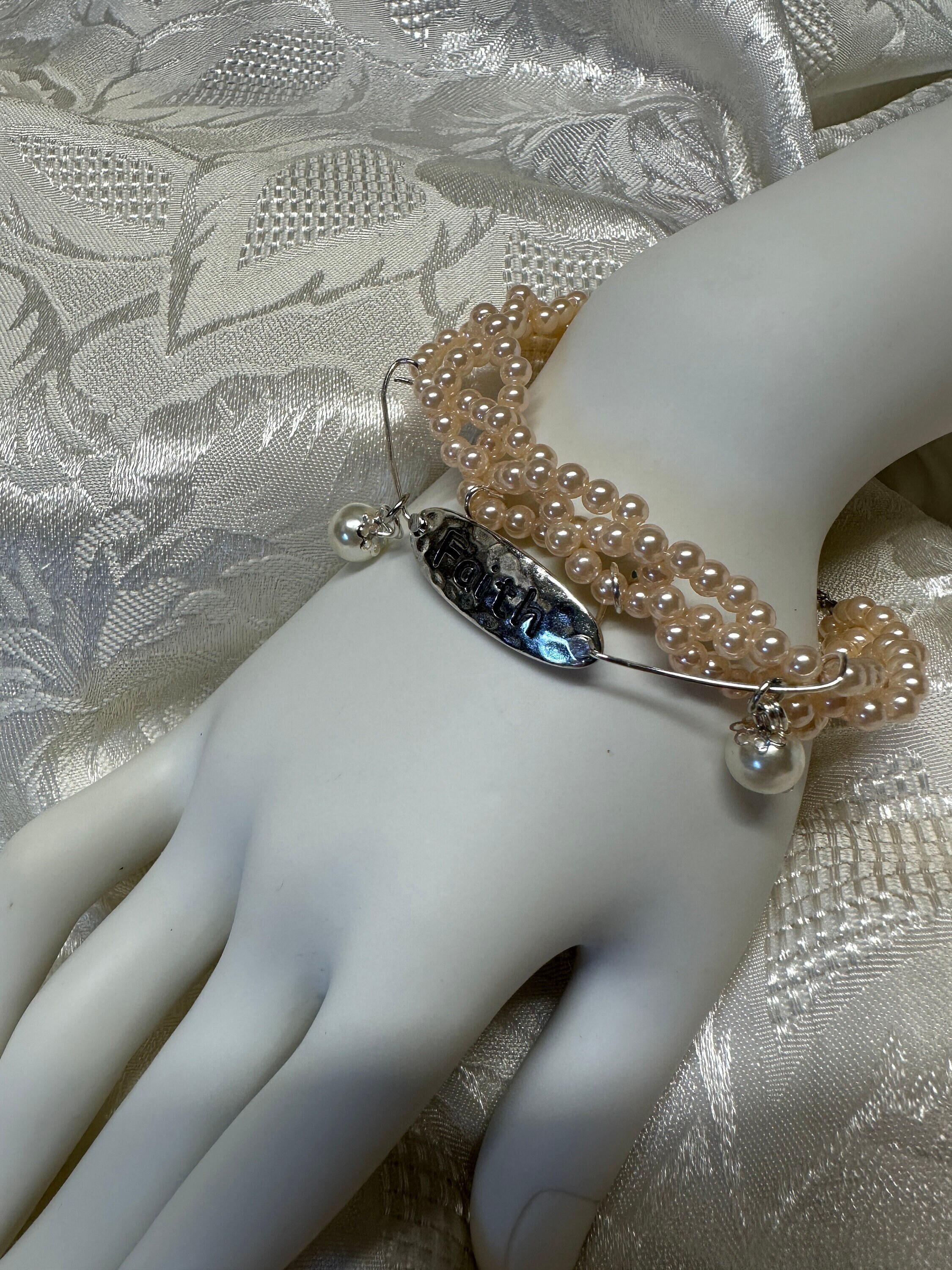 Christian bracelet with Faith charm, faux pearls, pinky peach and white colors, bracelet is 8 inches around wrist, coordinating earrings