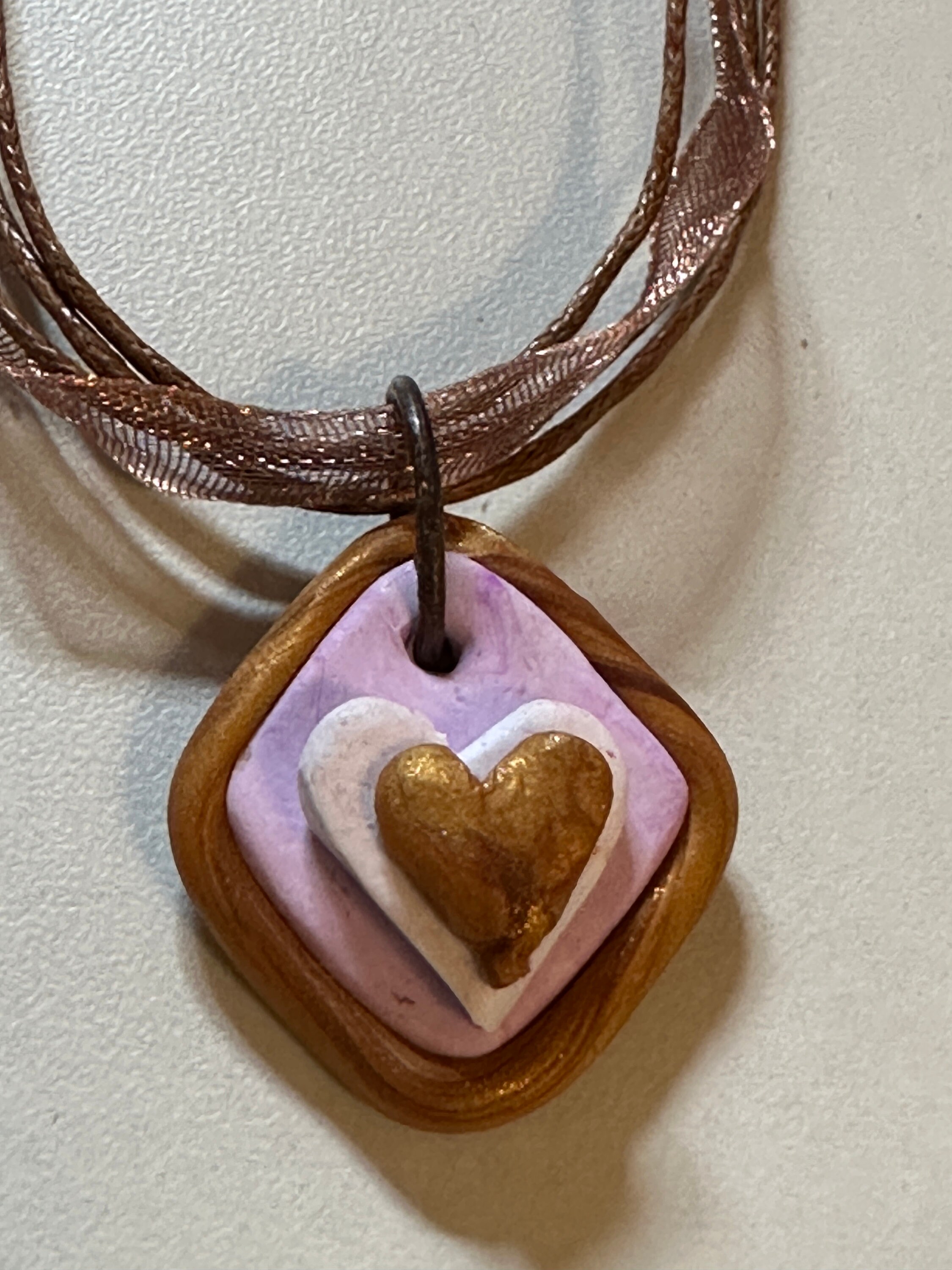 God's Love in My Heart necklace, copper, lavender and white polymer, ribbon and brown strands