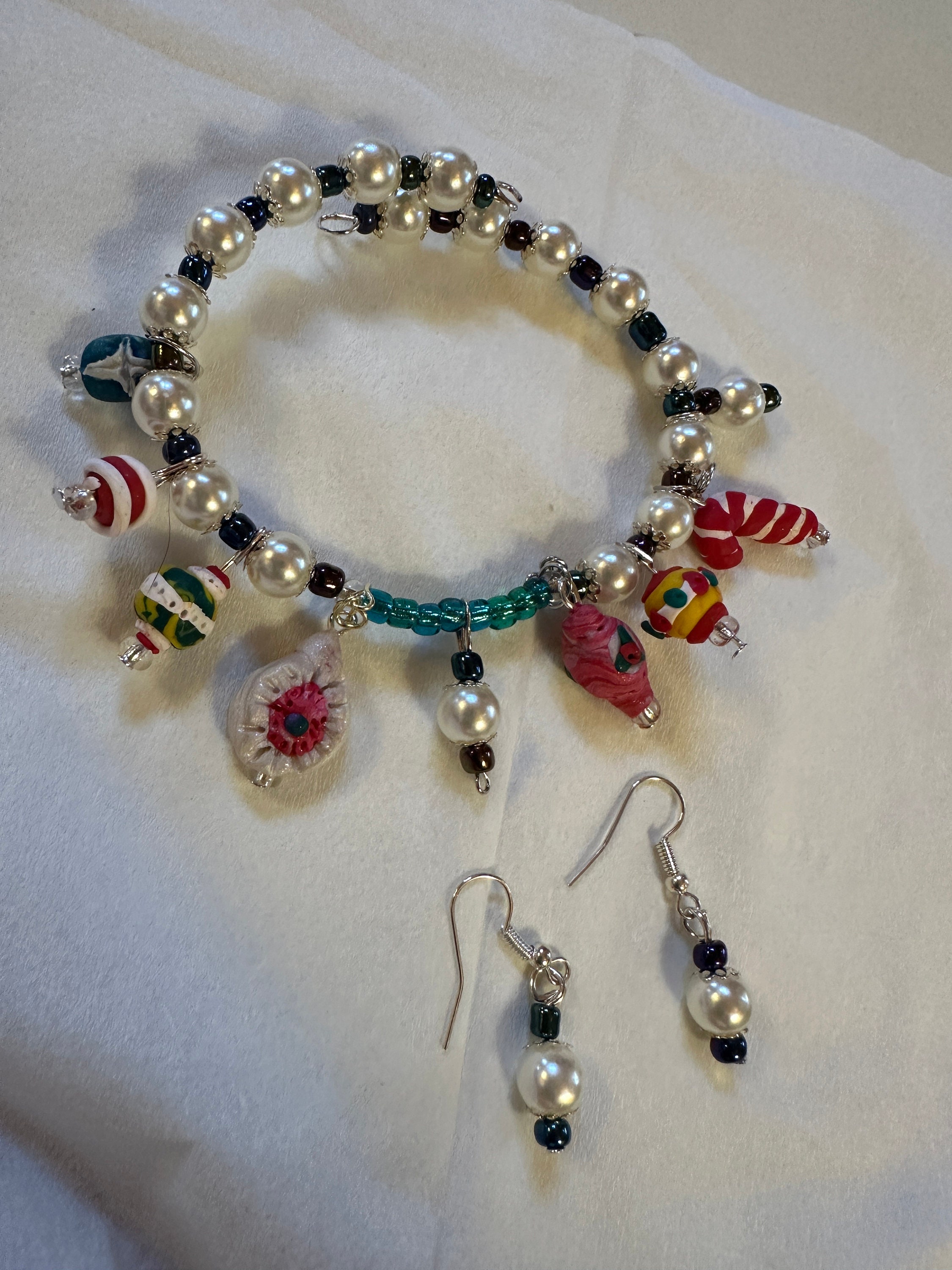 Expandable coil bracelet featuring hand crafted Christmas ornament beads, unique Christmas gift, includes matching earrings