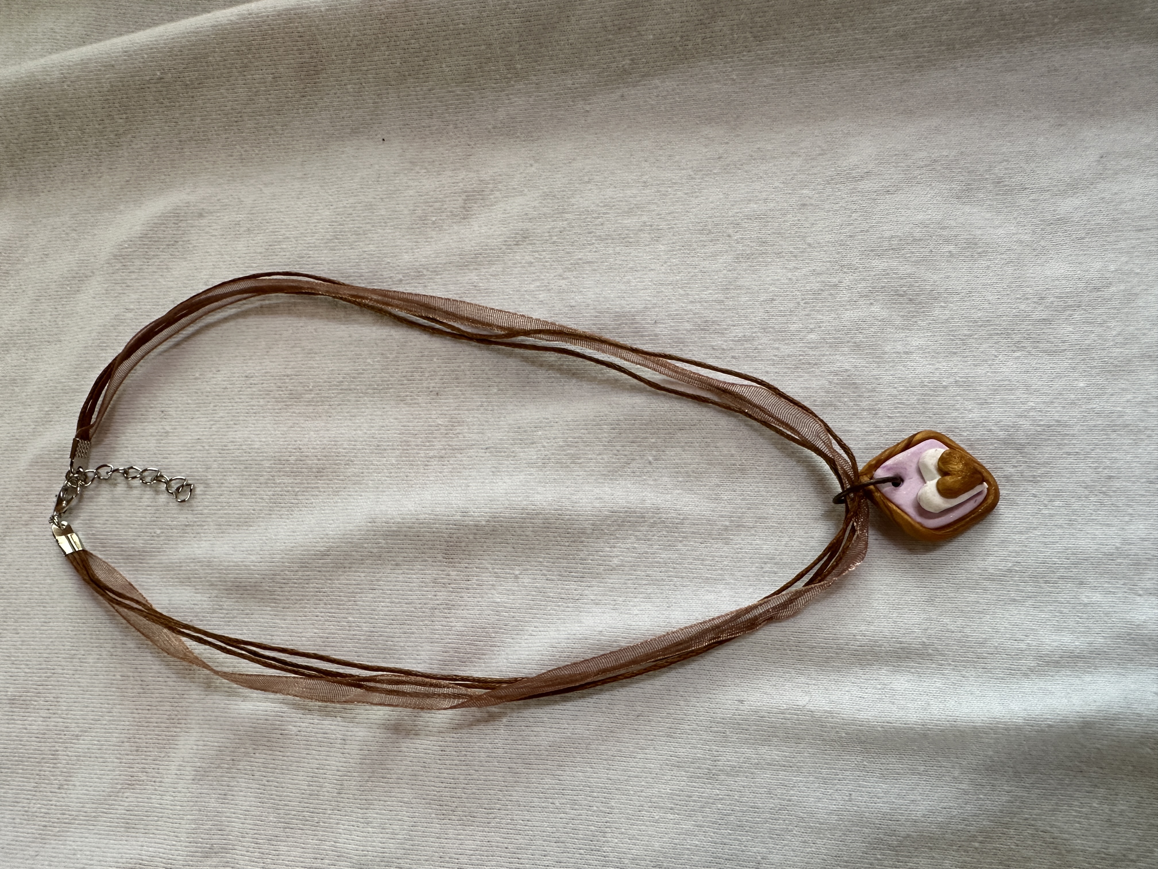 God's Love in My Heart necklace, copper, lavender and white polymer, ribbon and brown strands