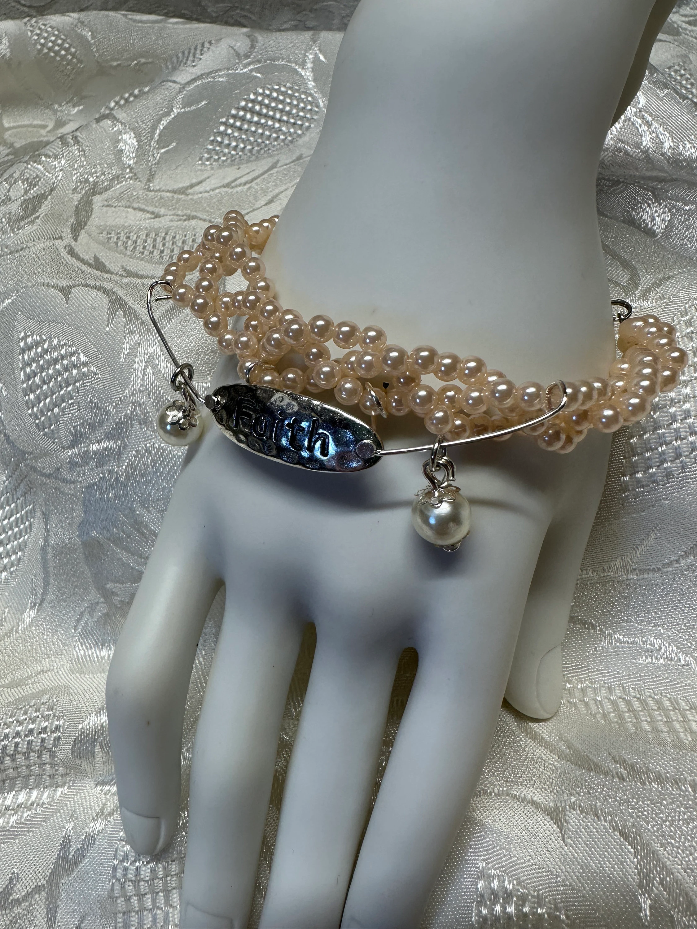 Christian bracelet with Faith charm, faux pearls, pinky peach and white colors, bracelet is 8 inches around wrist, coordinating earrings