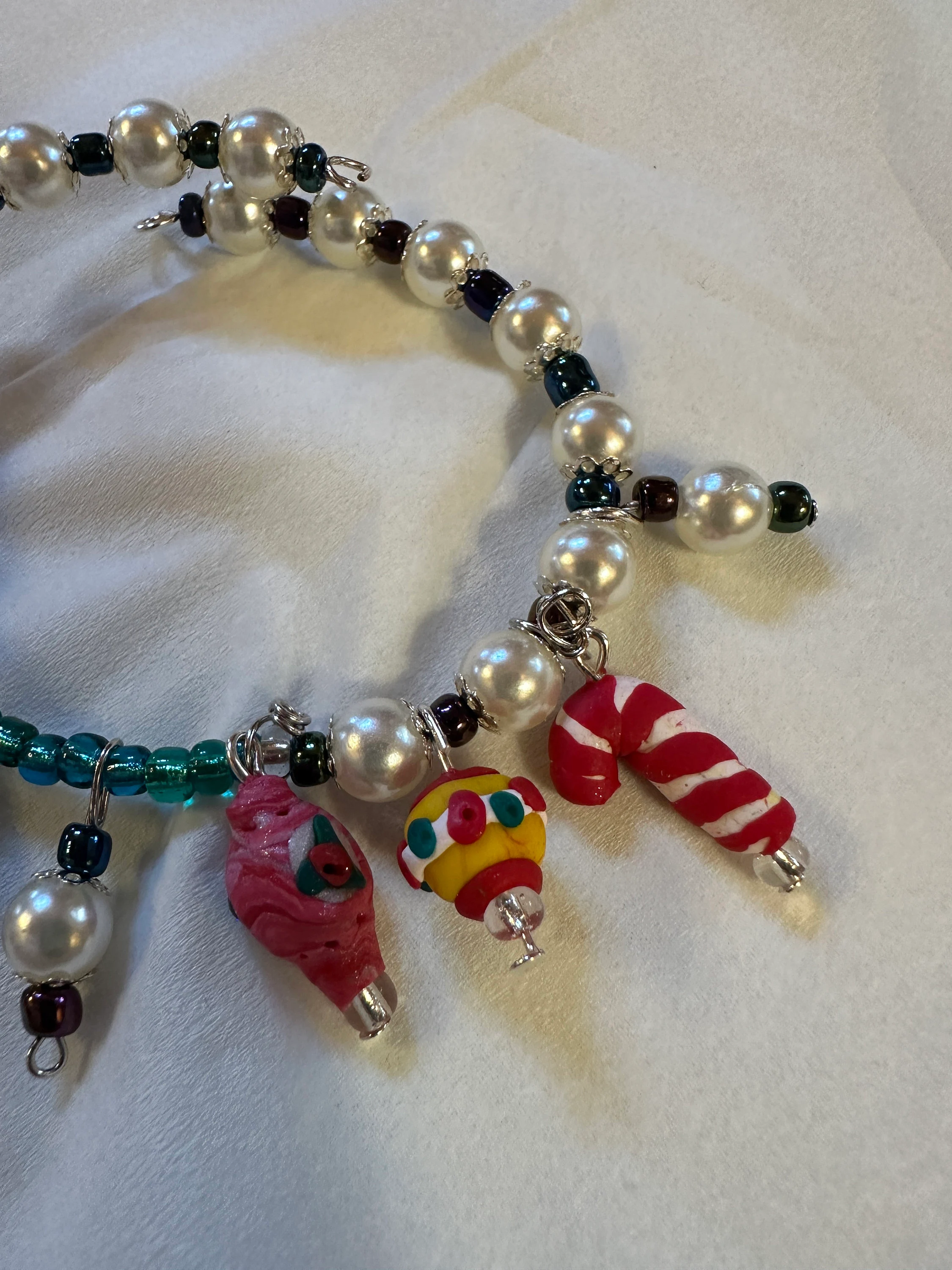 Expandable coil bracelet featuring hand crafted Christmas ornament beads, unique Christmas gift, includes matching earrings