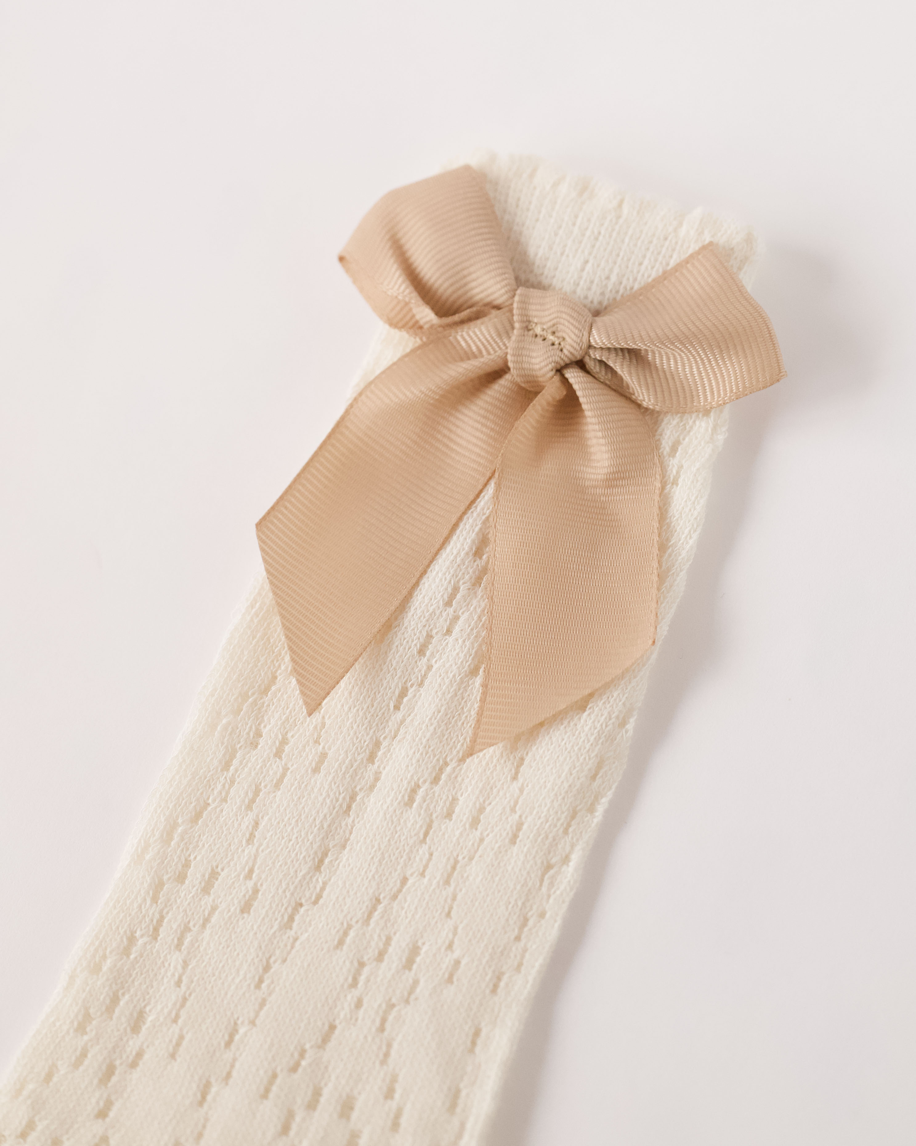 Vaikiškos kojinės iki kelių su kaspinėliu