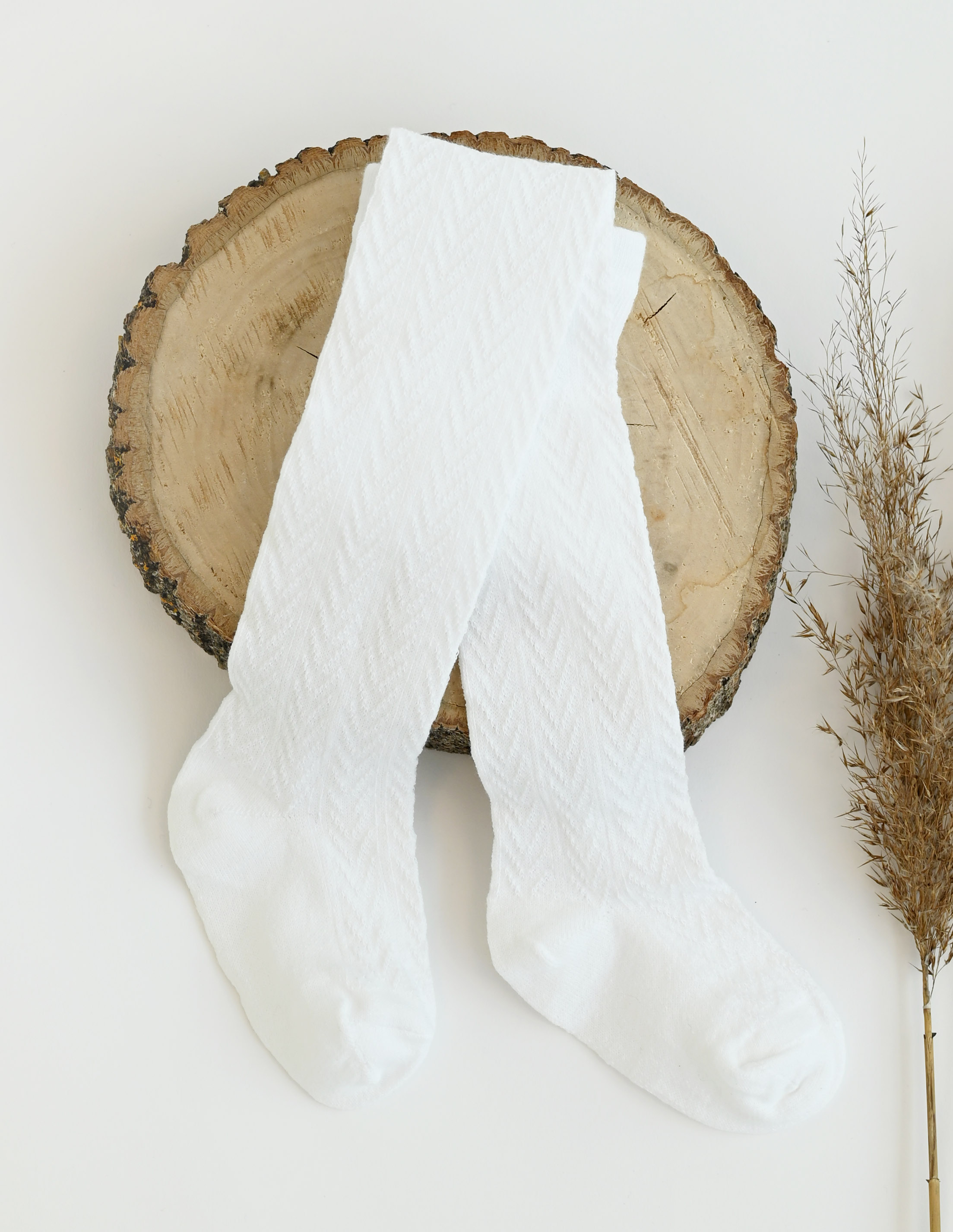 Raštuotos, baltos vaikiškos pėdkelnės 