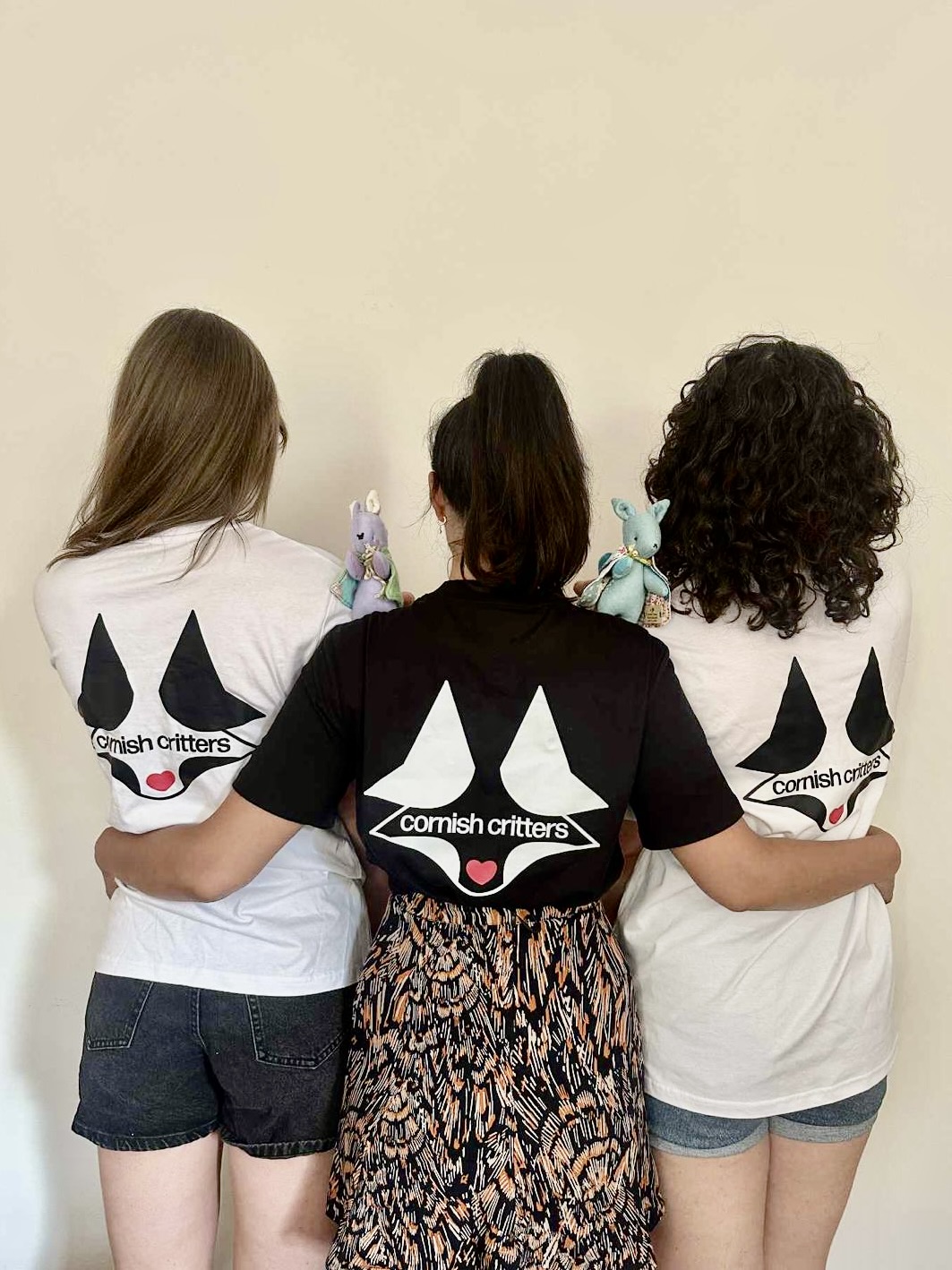 Adult sized white t-shirt with black logo
