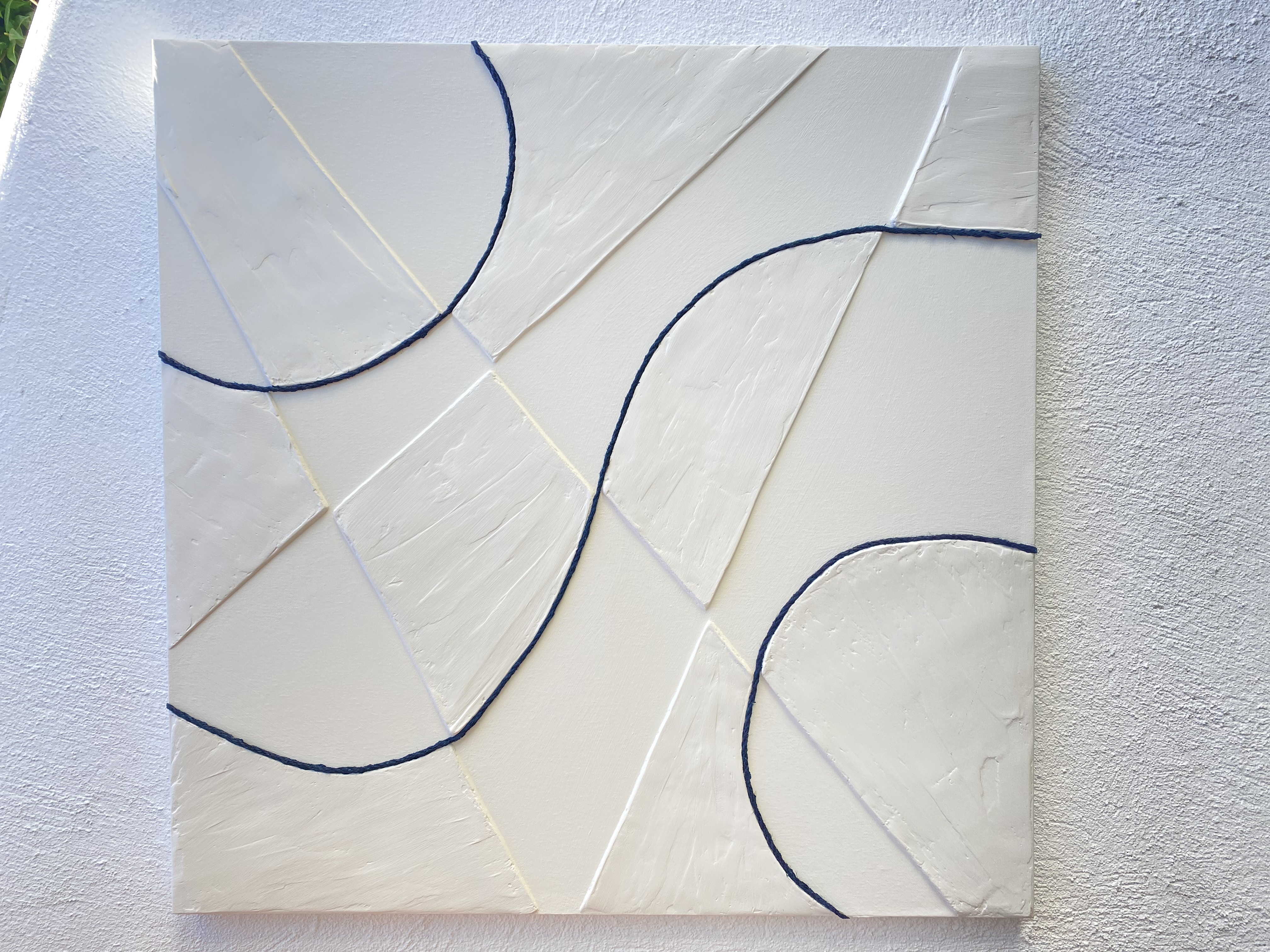 El 12 en blanco lino y azul