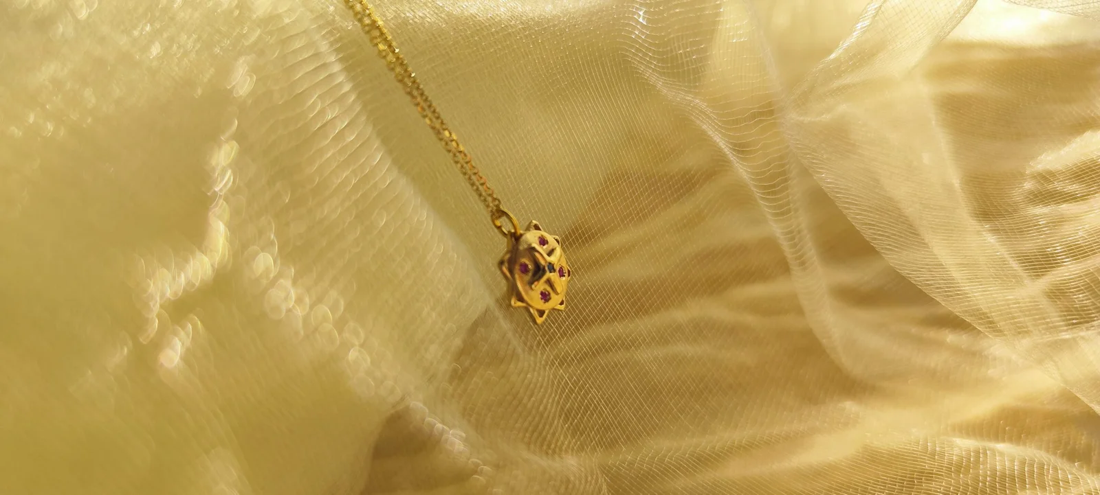 Colgante Llave de Saturno bañada en oro