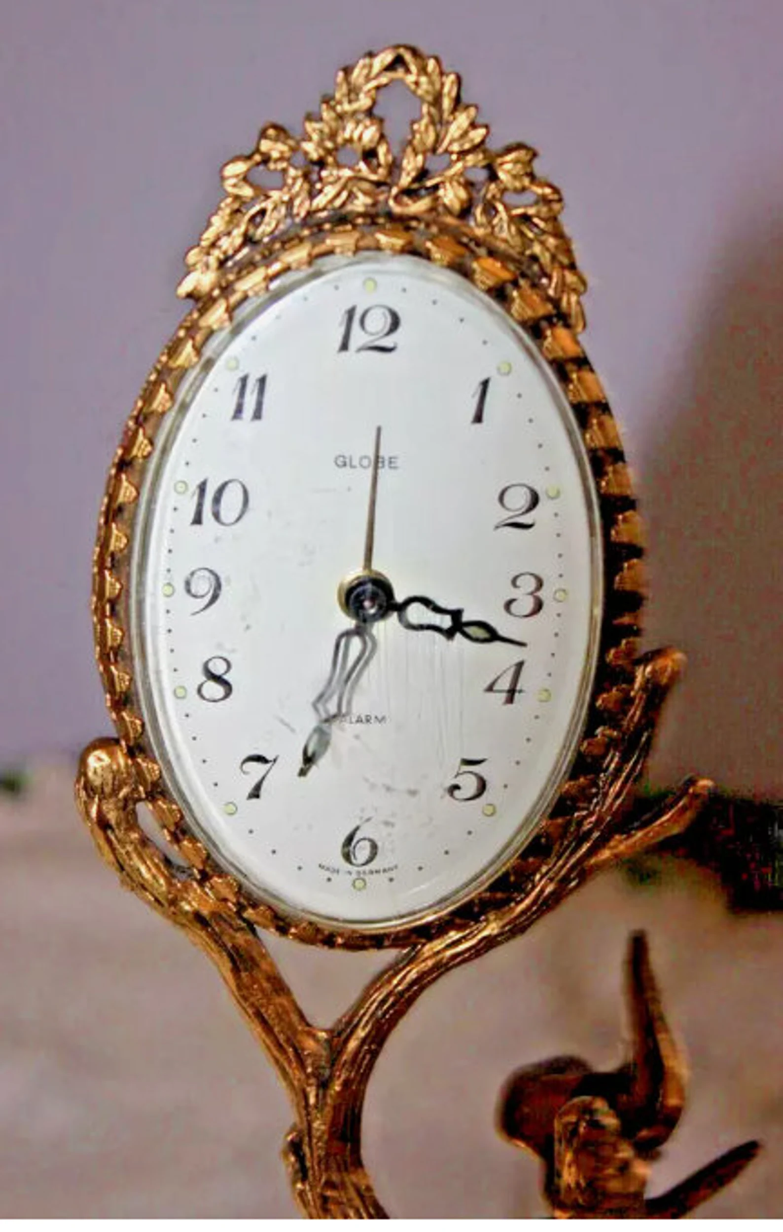 GLOBE German figural brass color metal mechanical clock CIRCA 1940s