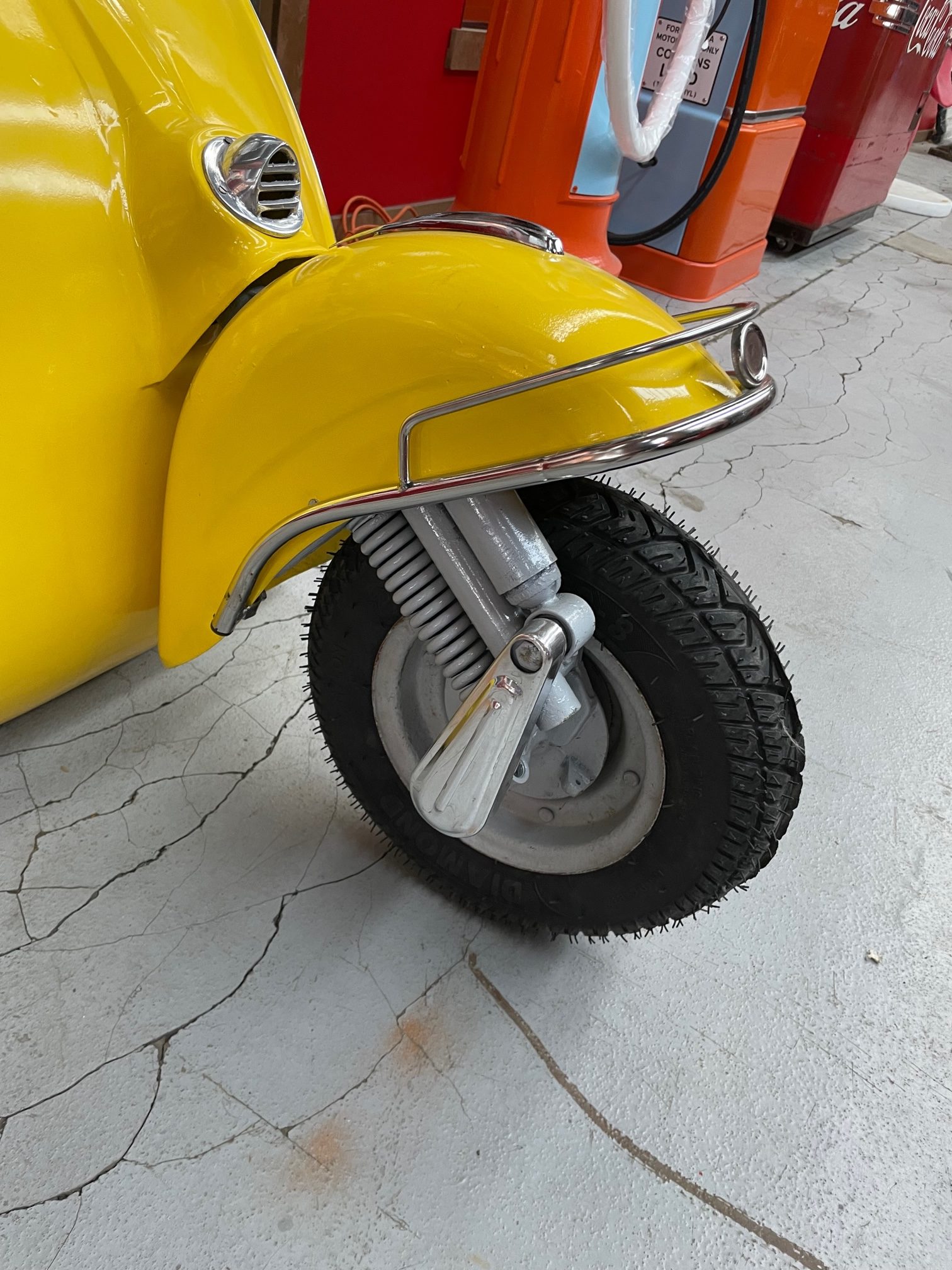 Front face of full-size vespa Yellow vintage wall decoration
