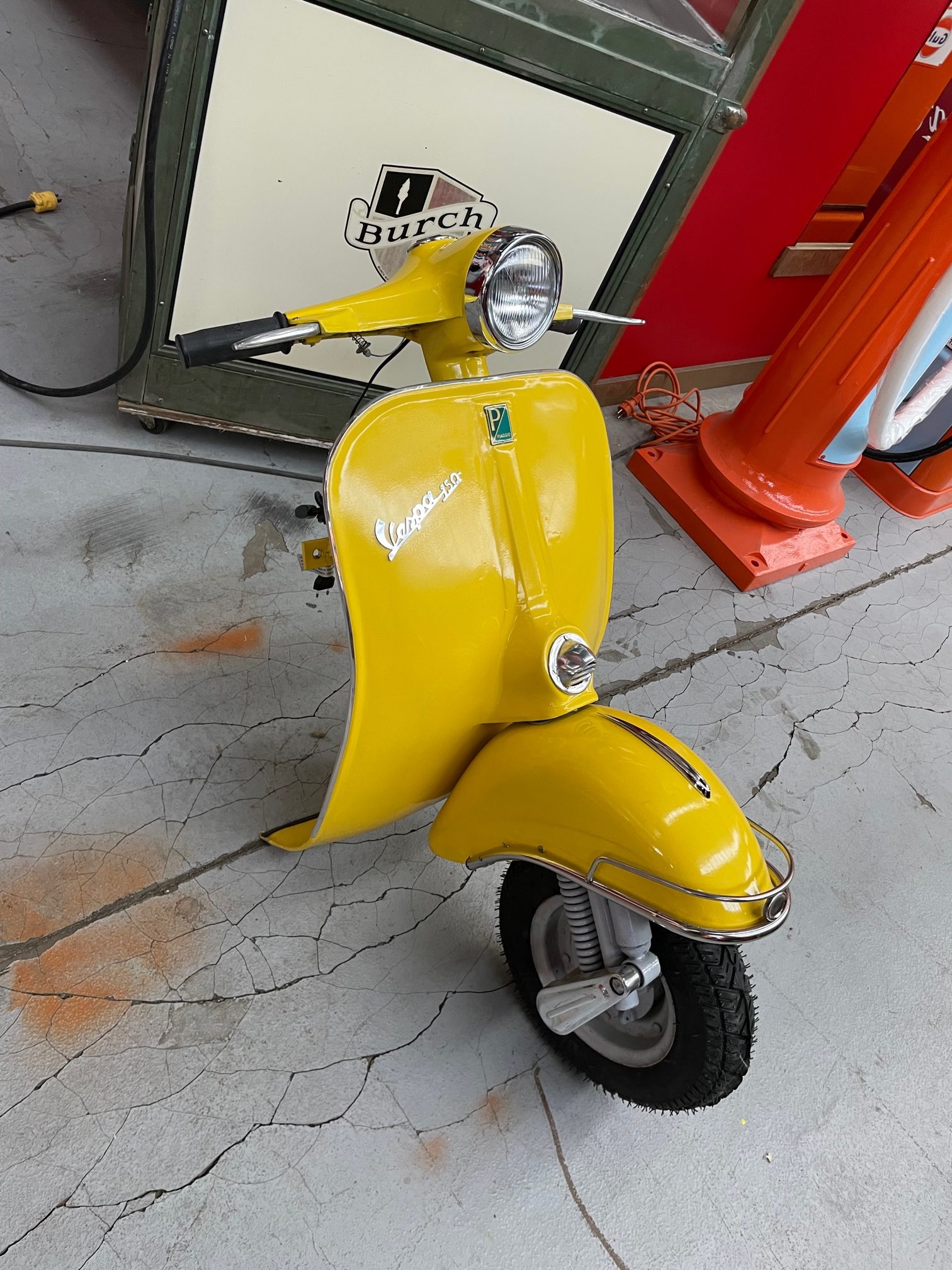 Front face of full-size vespa Yellow vintage wall decoration