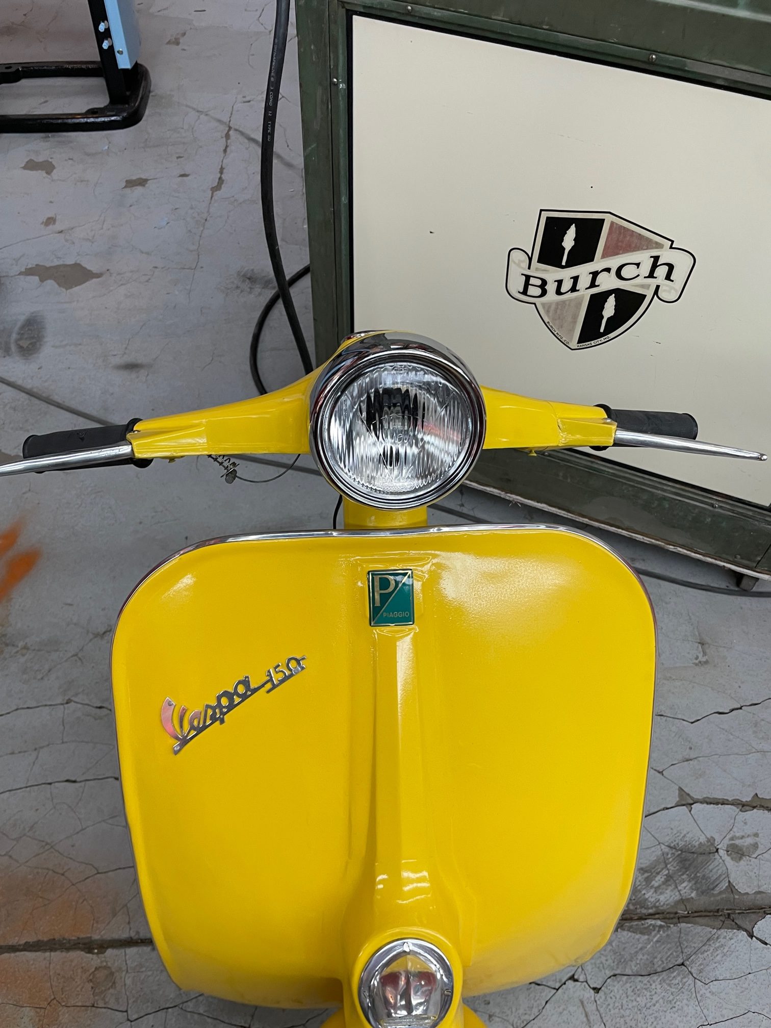 Front face of full-size vespa Yellow vintage wall decoration