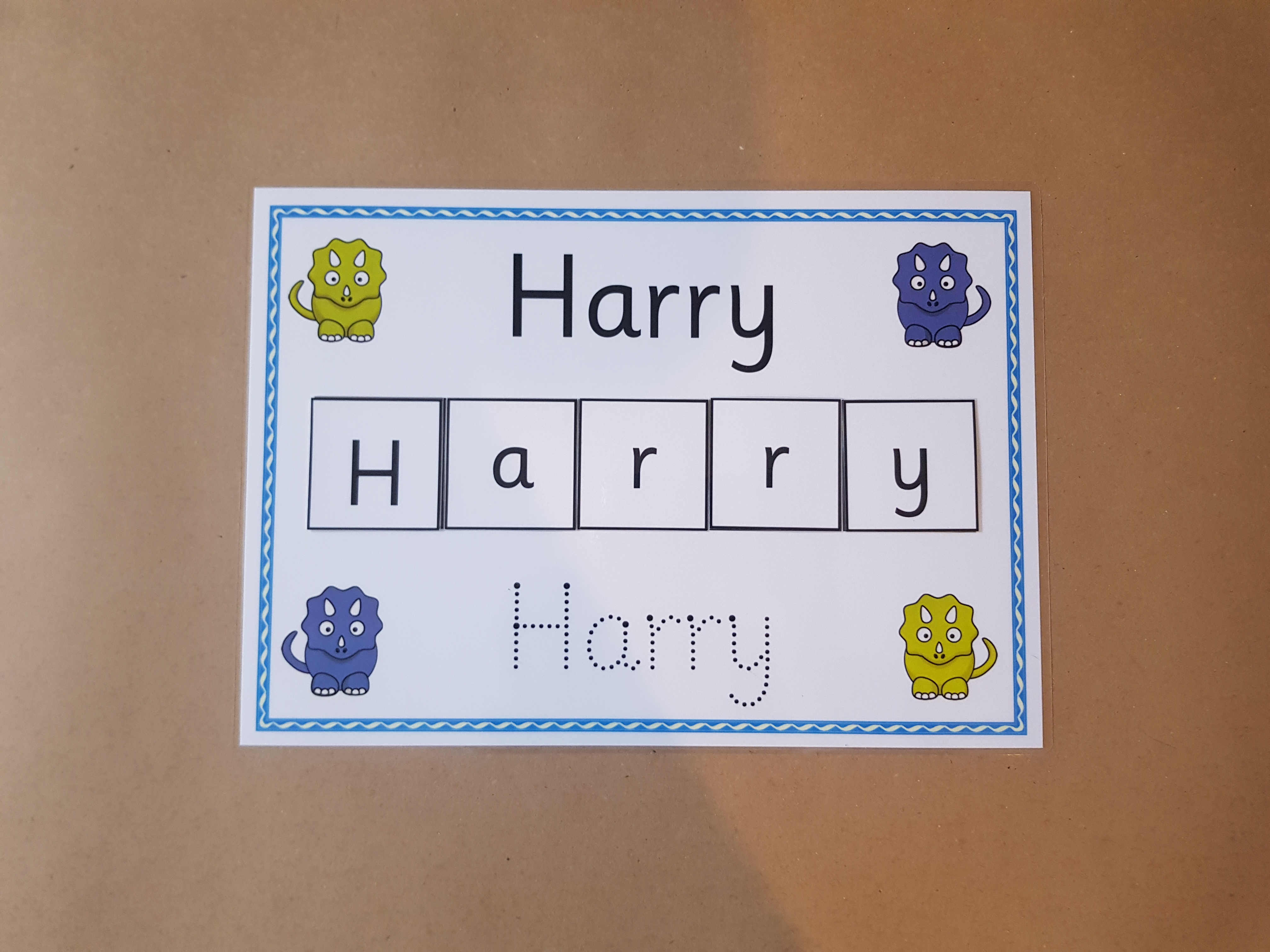 Write and Spell Name card - dinosaurs design 