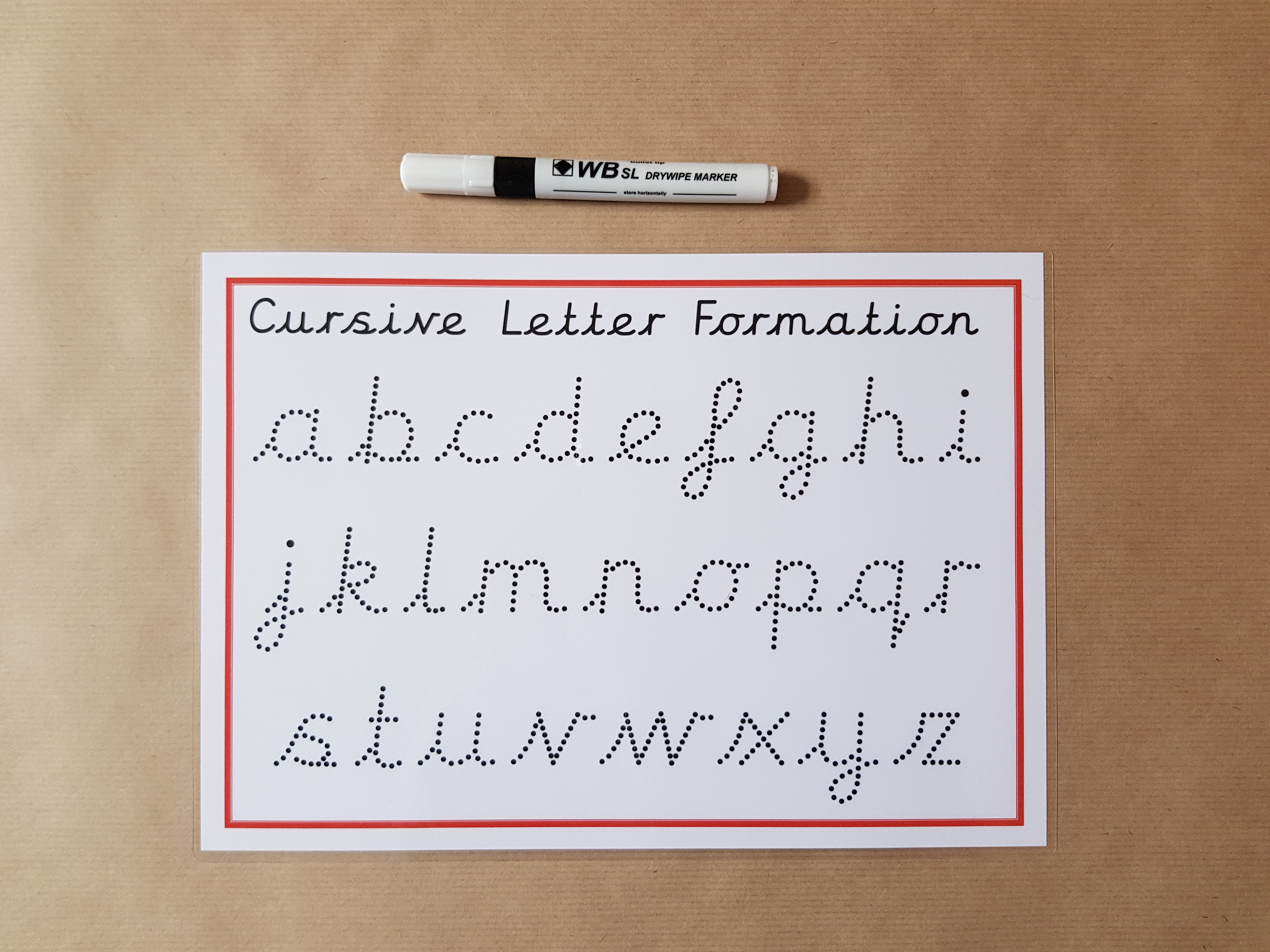 Cursive dotted letter formation 