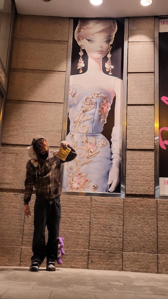 Plaid brown zipup with hello kitty head plushie