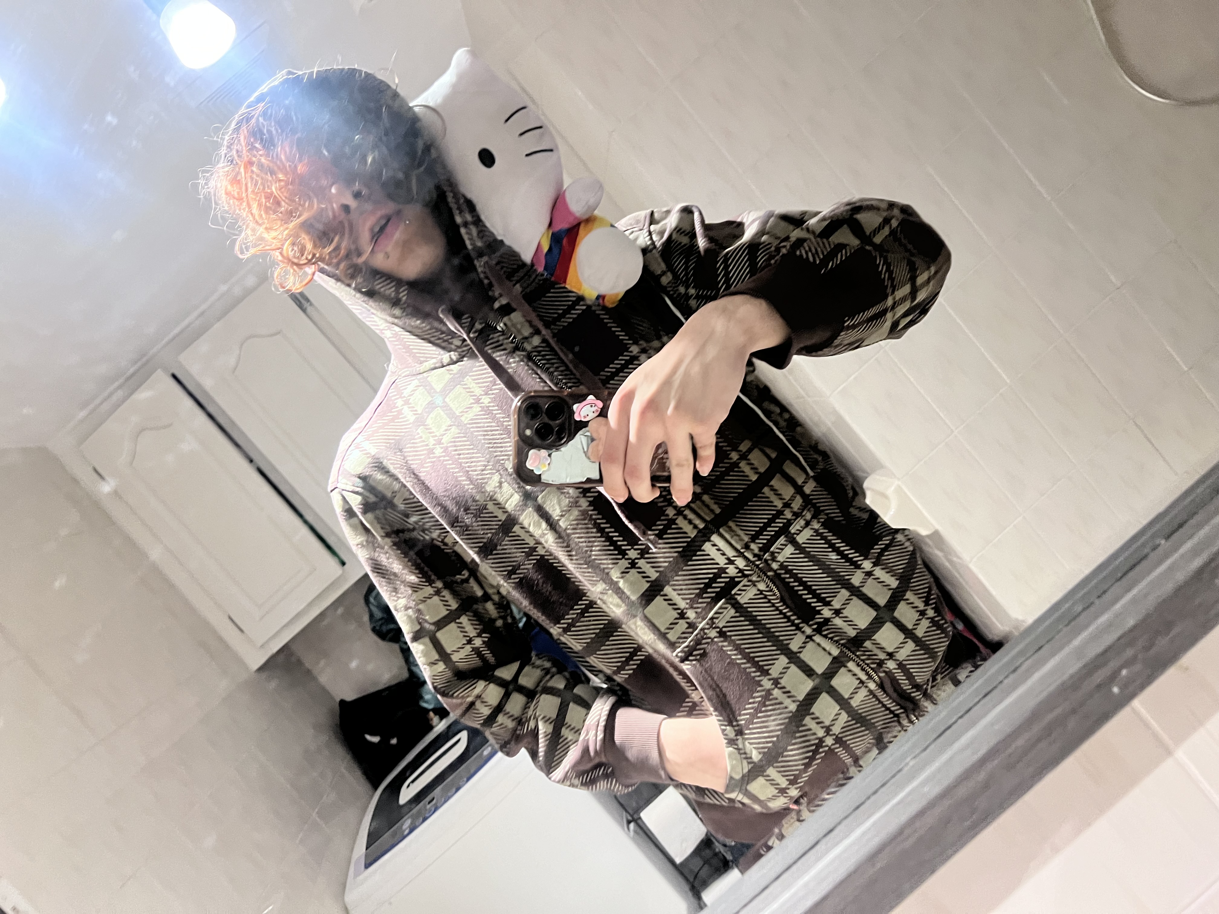 Plaid brown zipup with hello kitty head plushie