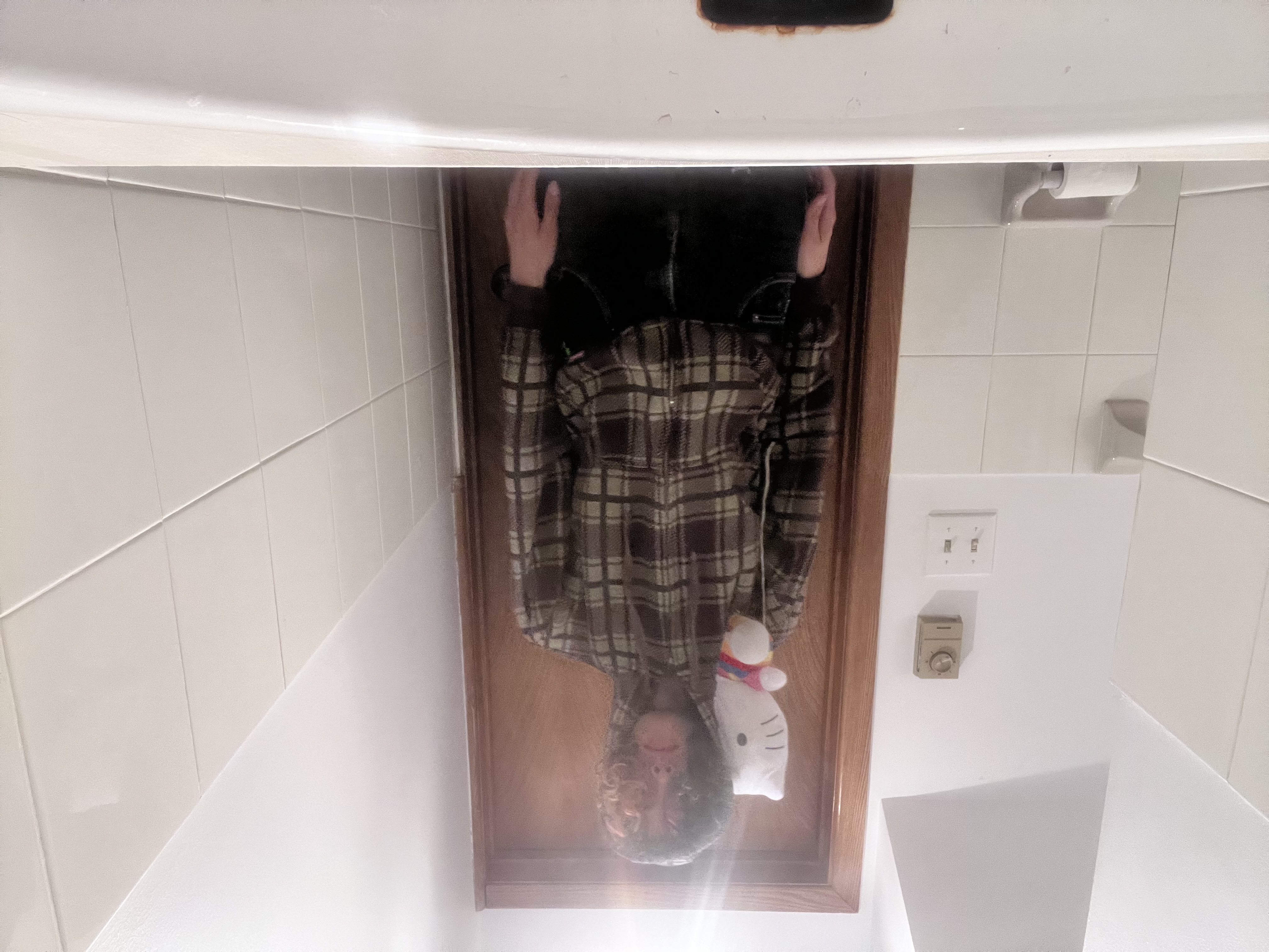 Plaid brown zipup with hello kitty head plushie