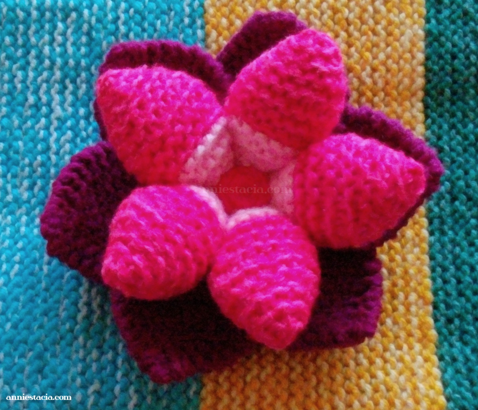 Dark pink knitted flower