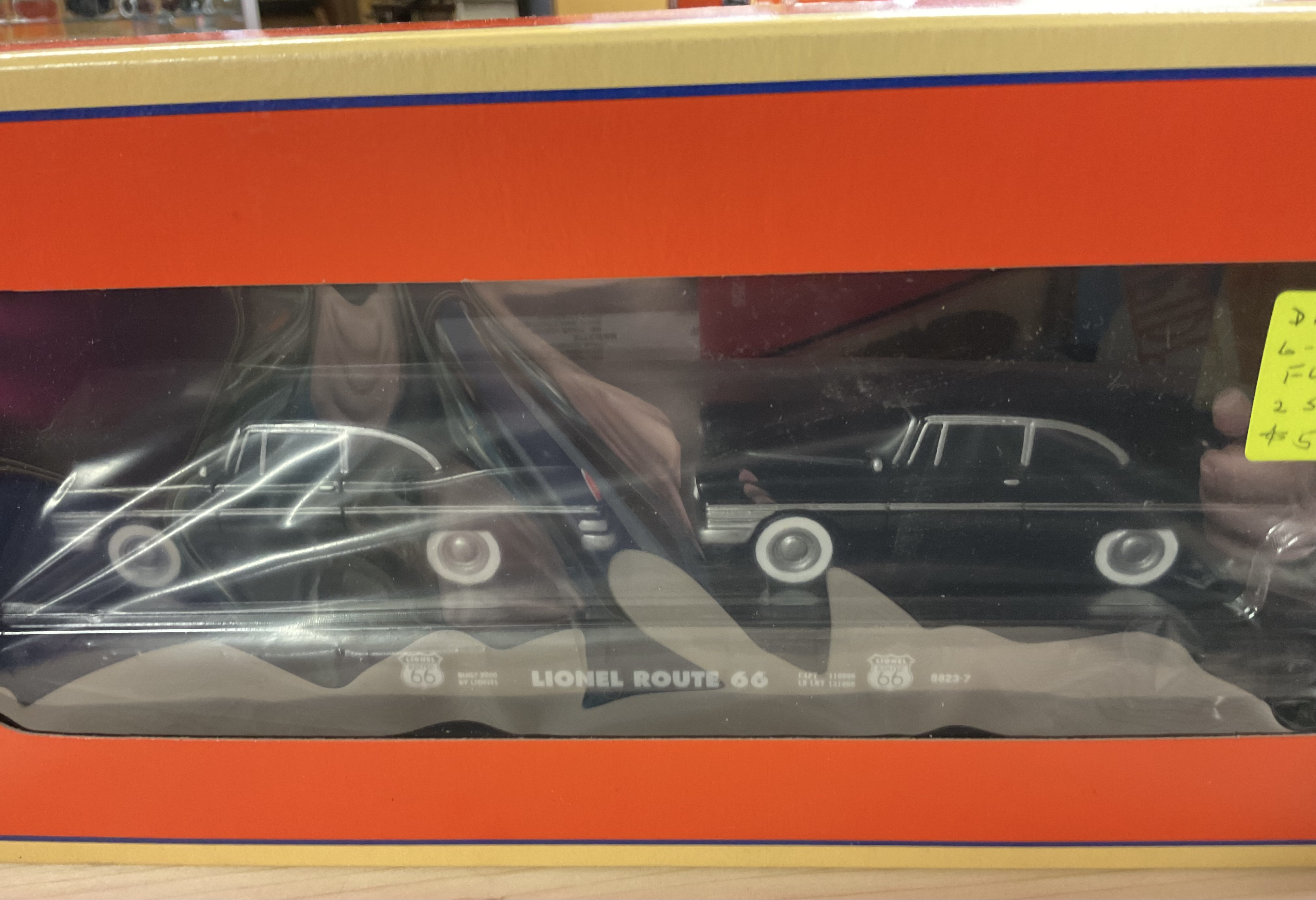 NOS (new old stock) Lionel 6-17557 O-Scale Route 66 Flat Car with 2 Black Sedans