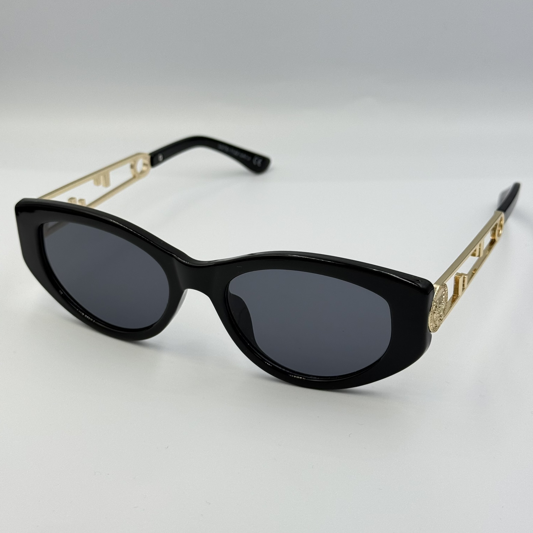 Gafas de sol patilla dorada
