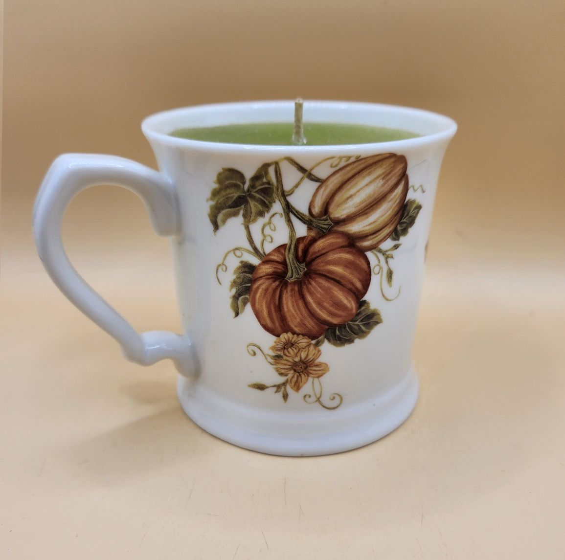 Pumpkin-themed ceramic candle cup