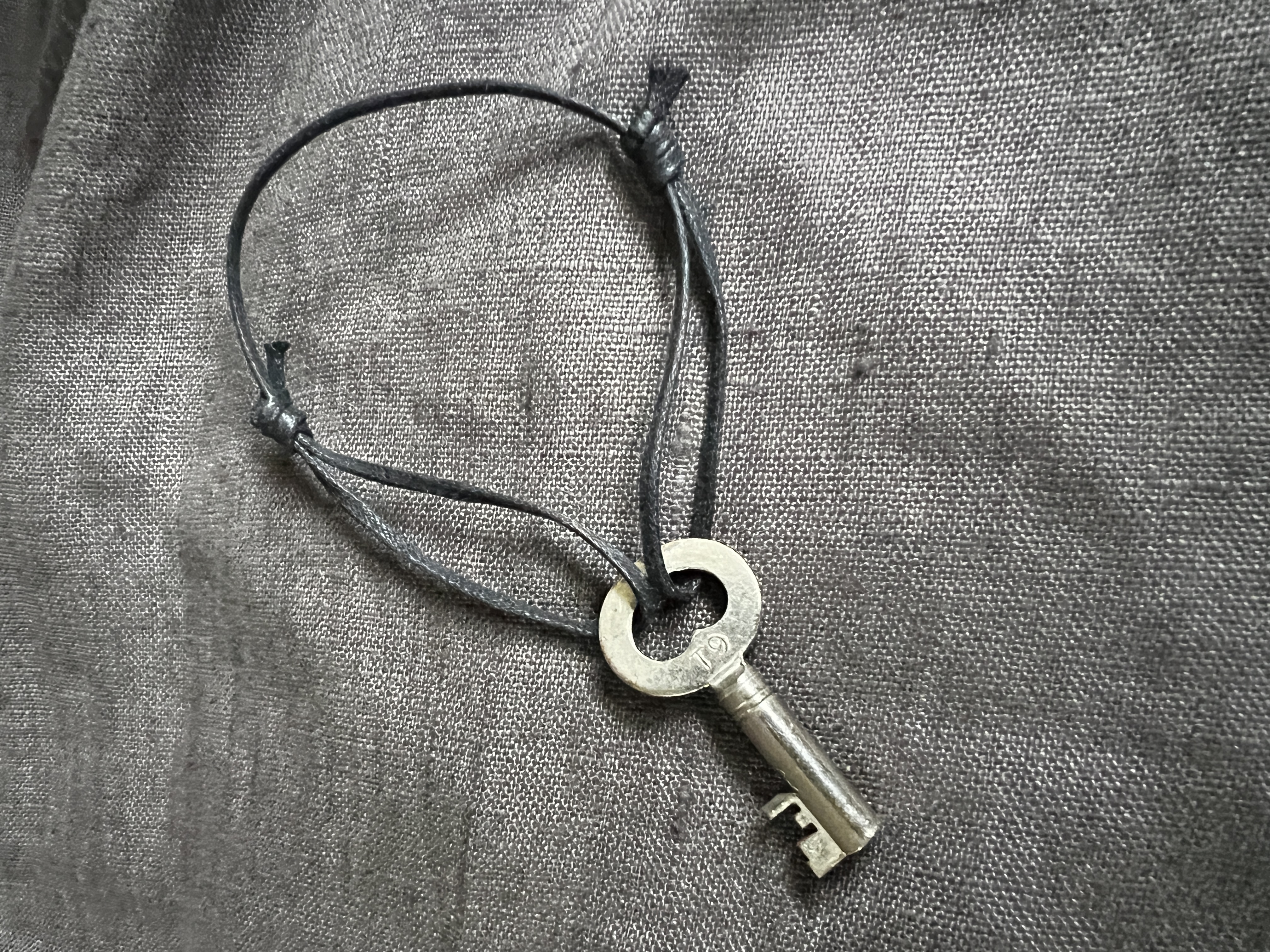 Silver key amulet