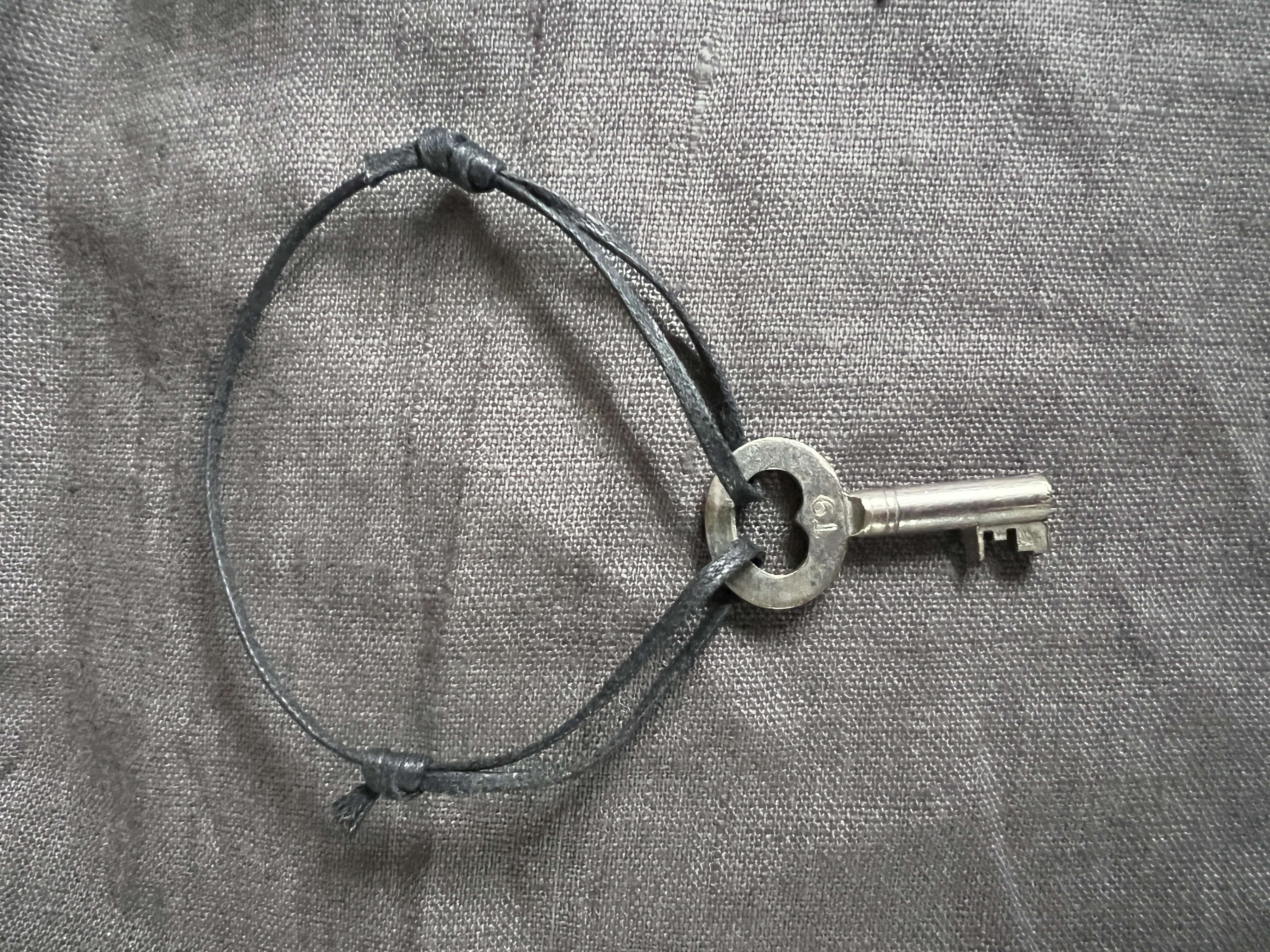 Silver key amulet
