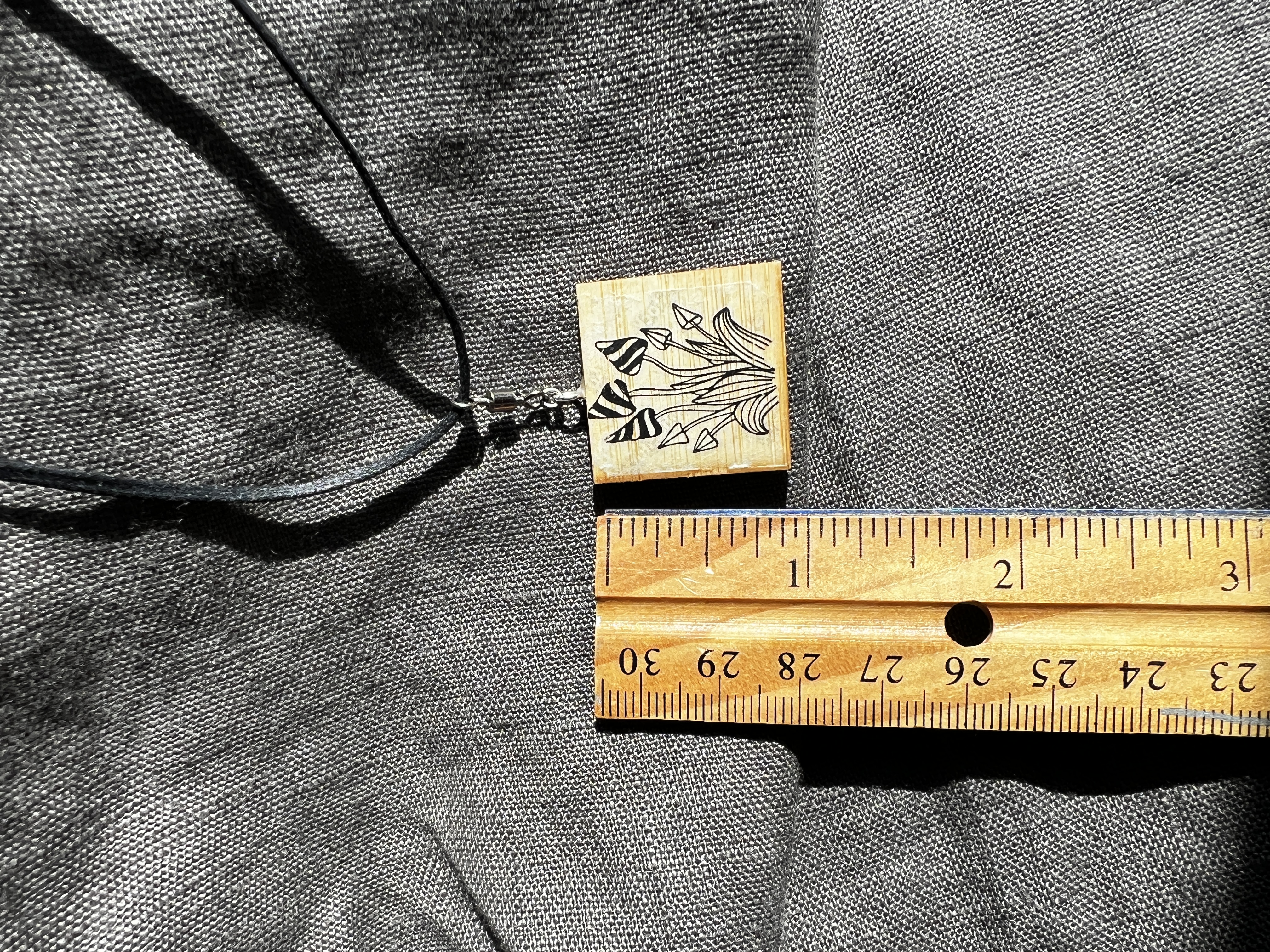 Revolving Wooden Pendant with Mushroom and Bee Design