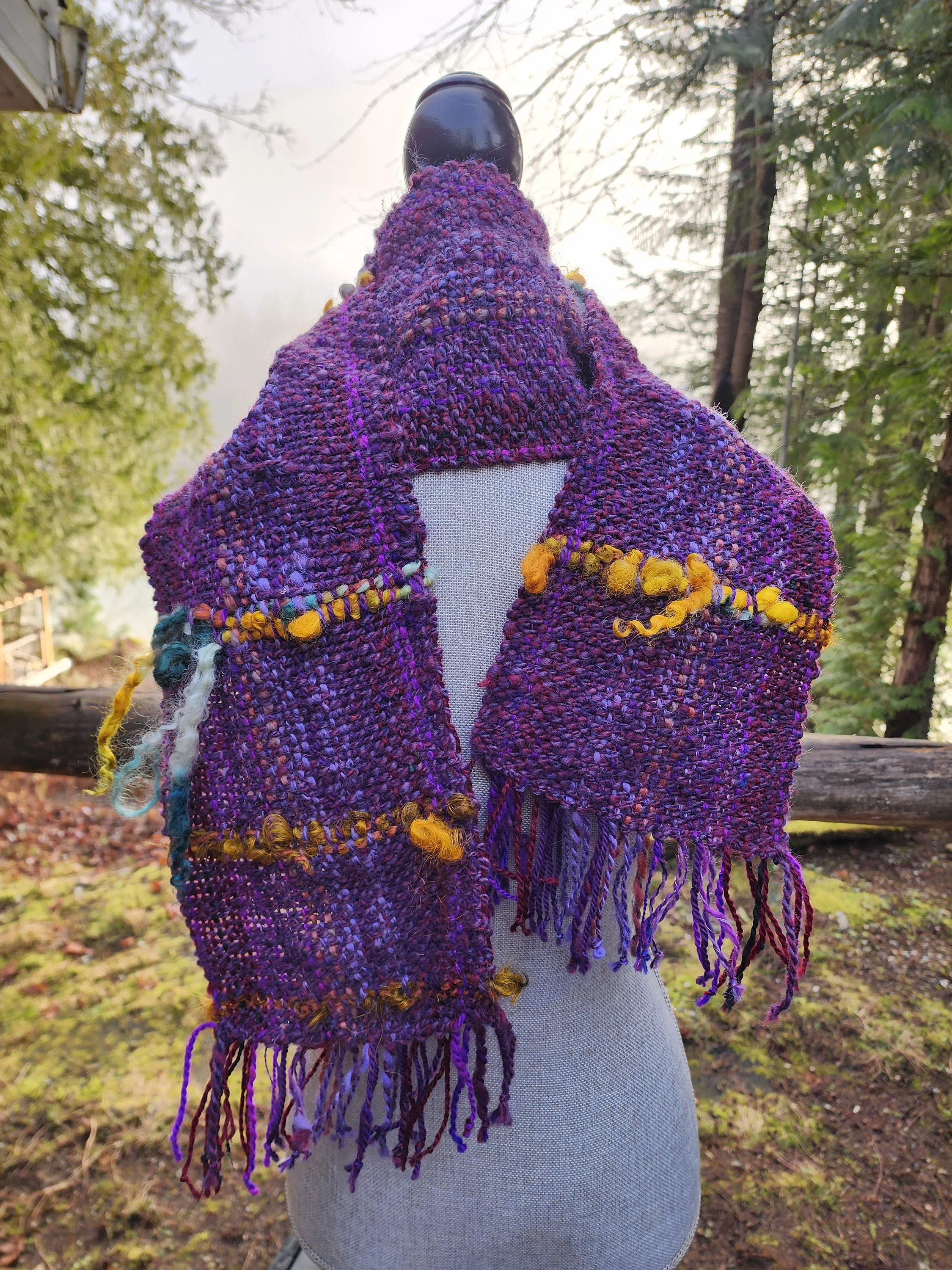 Handspun, hand dyed and woven purple wool with colorful art yarn added. Unique art scarf.yarn