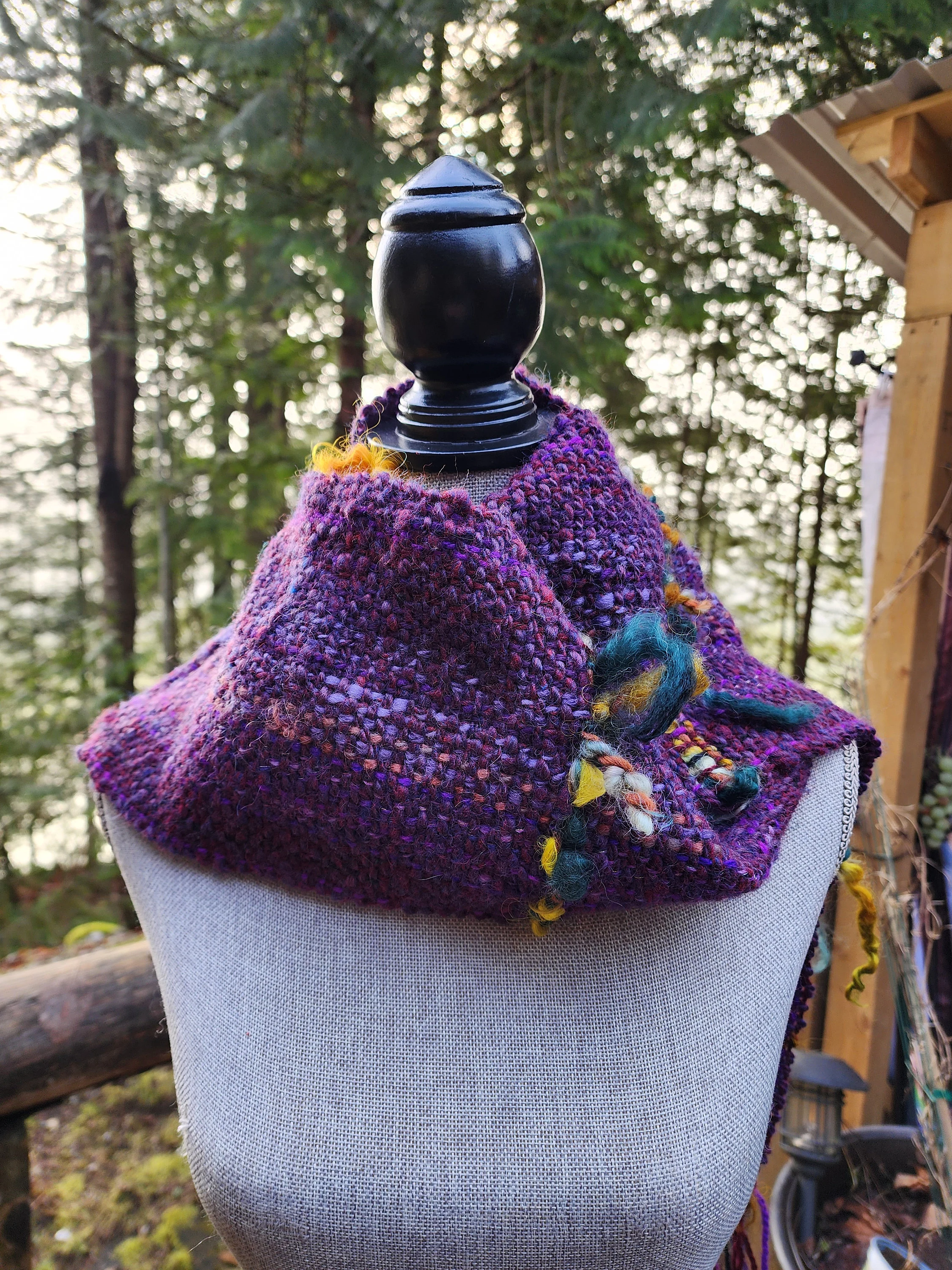 Handspun, hand dyed and woven purple wool with colorful art yarn added.  Unique art scarf.yarn