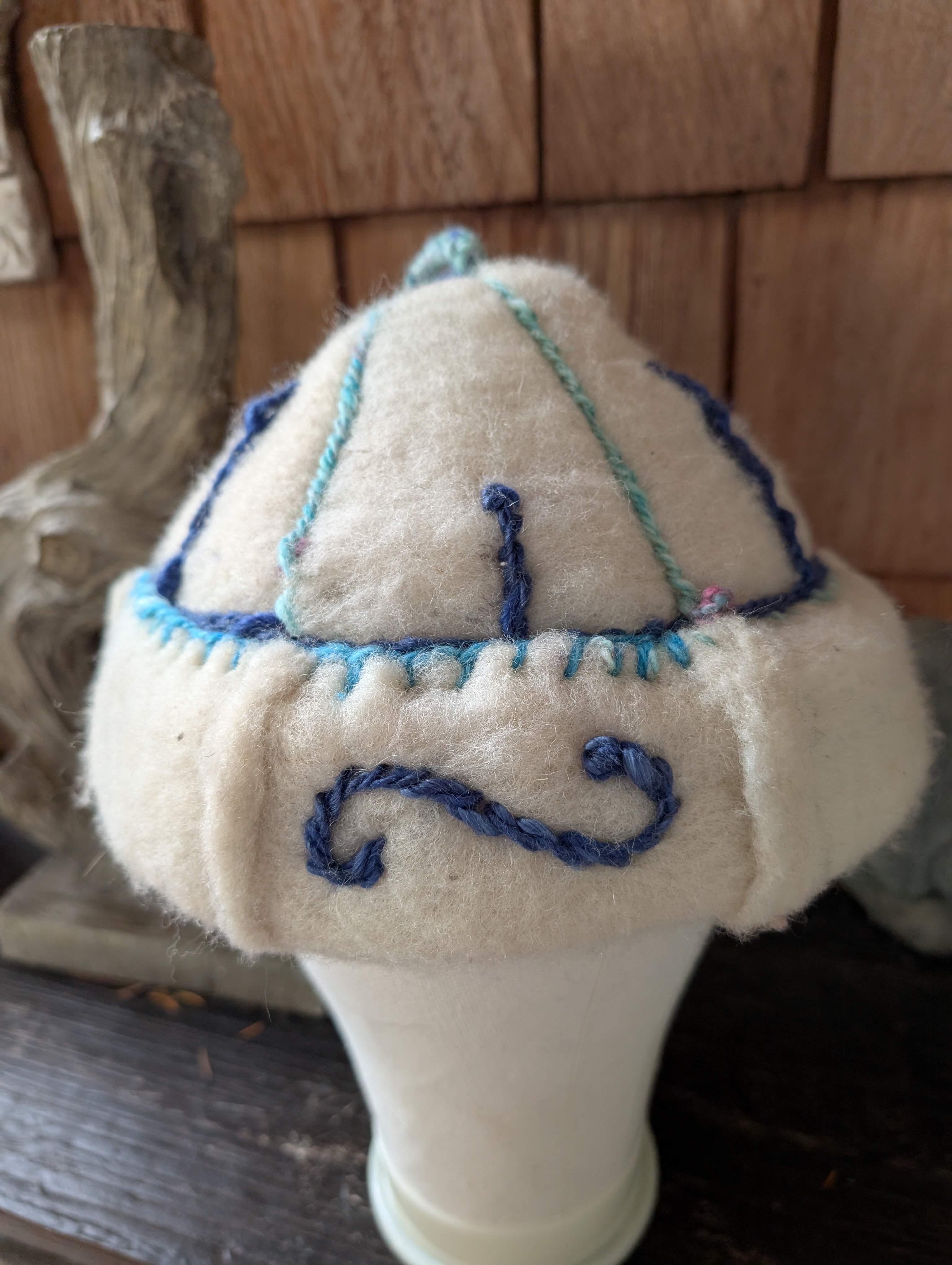 Handfelted wool hat with handspun embroidery