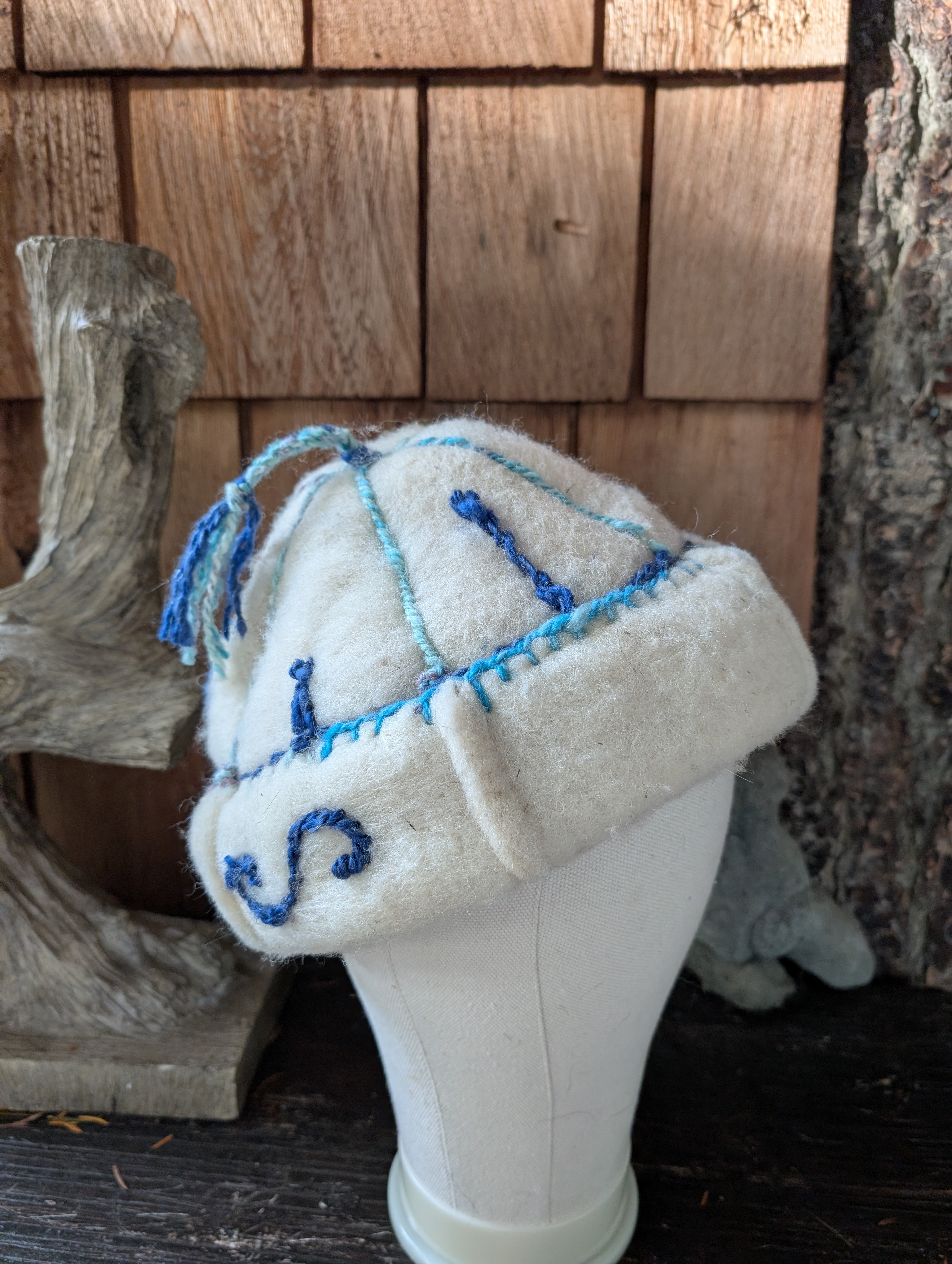 Handfelted wool hat with handspun embroidery