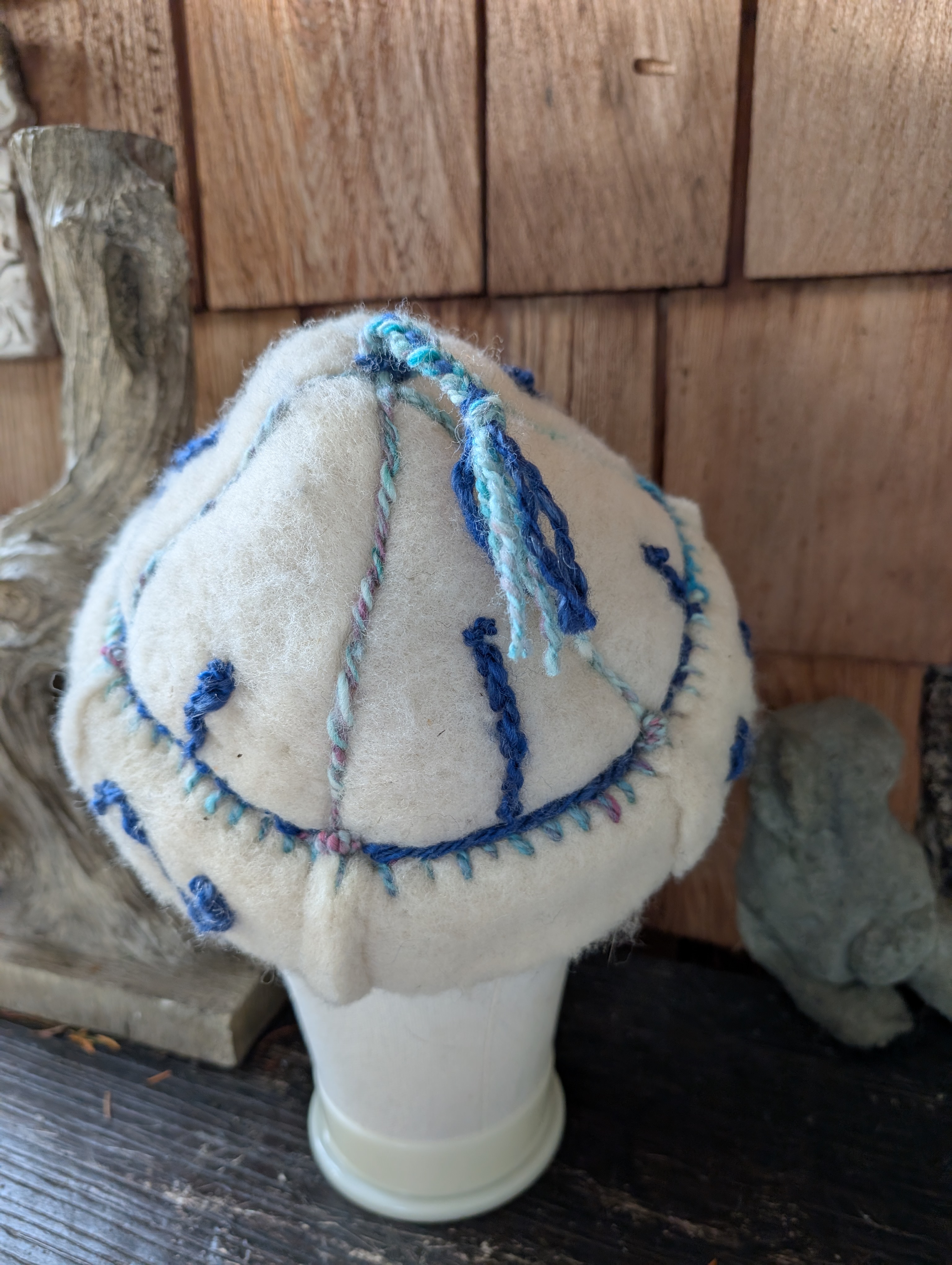Handfelted wool hat with handspun embroidery
