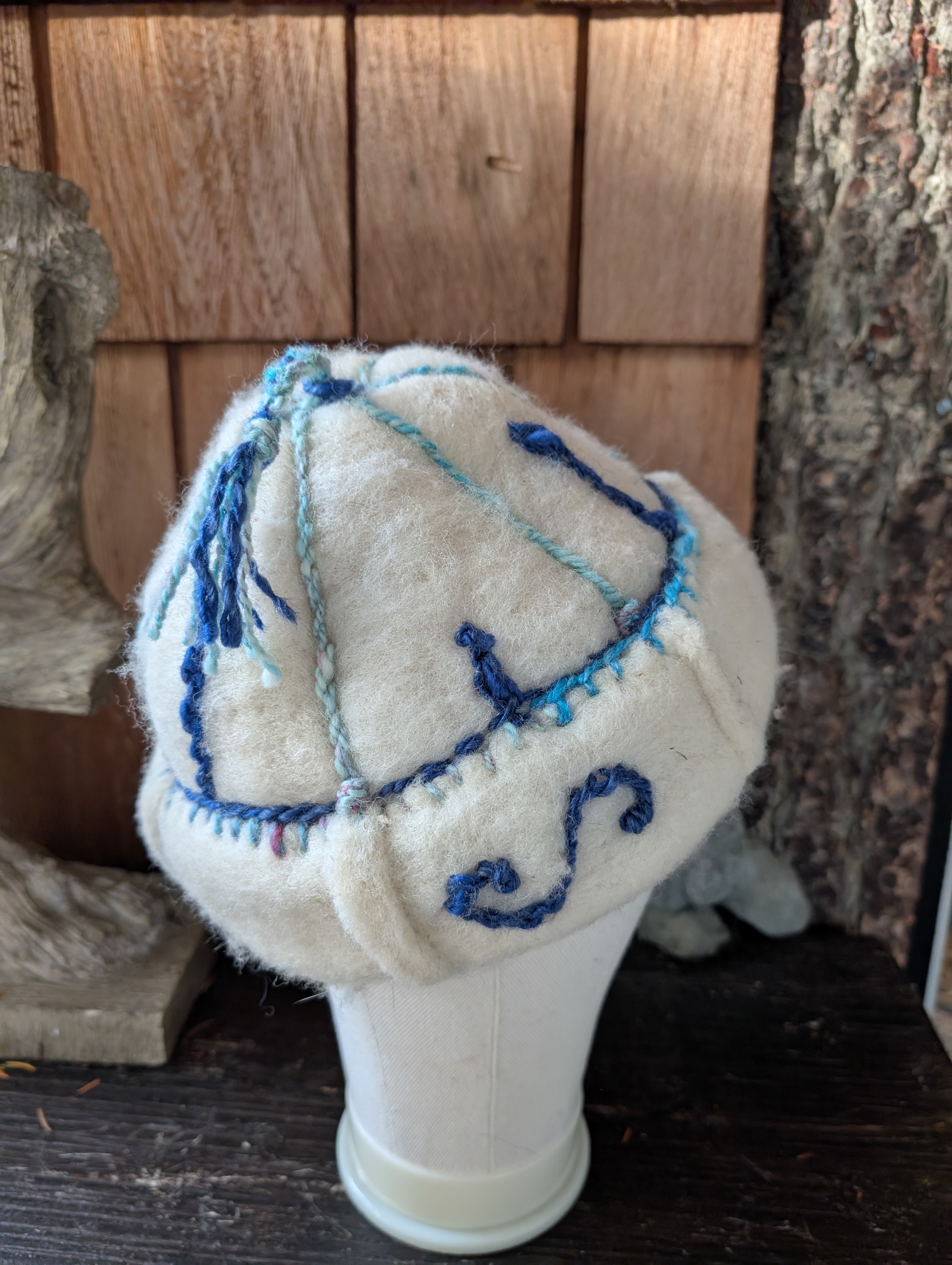 Handfelted wool hat with handspun embroidery