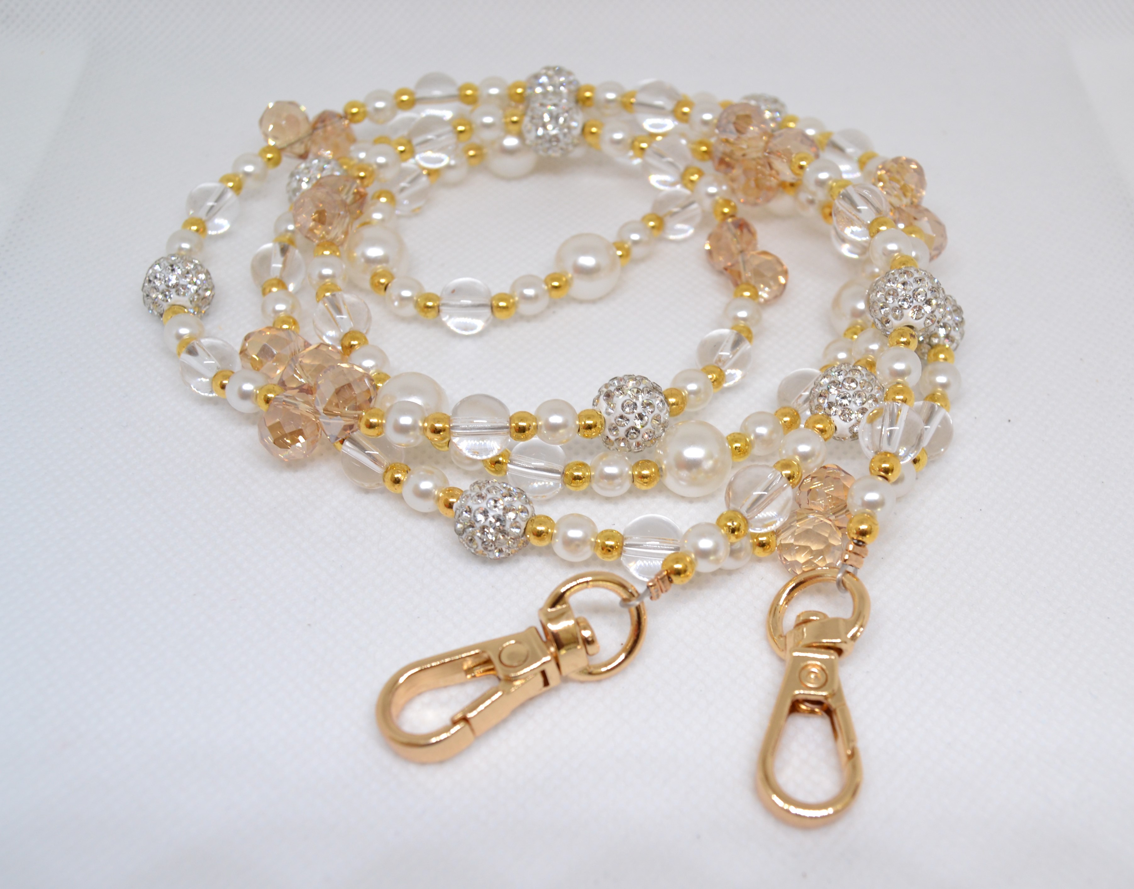 Žėrintys karoliai telefonui