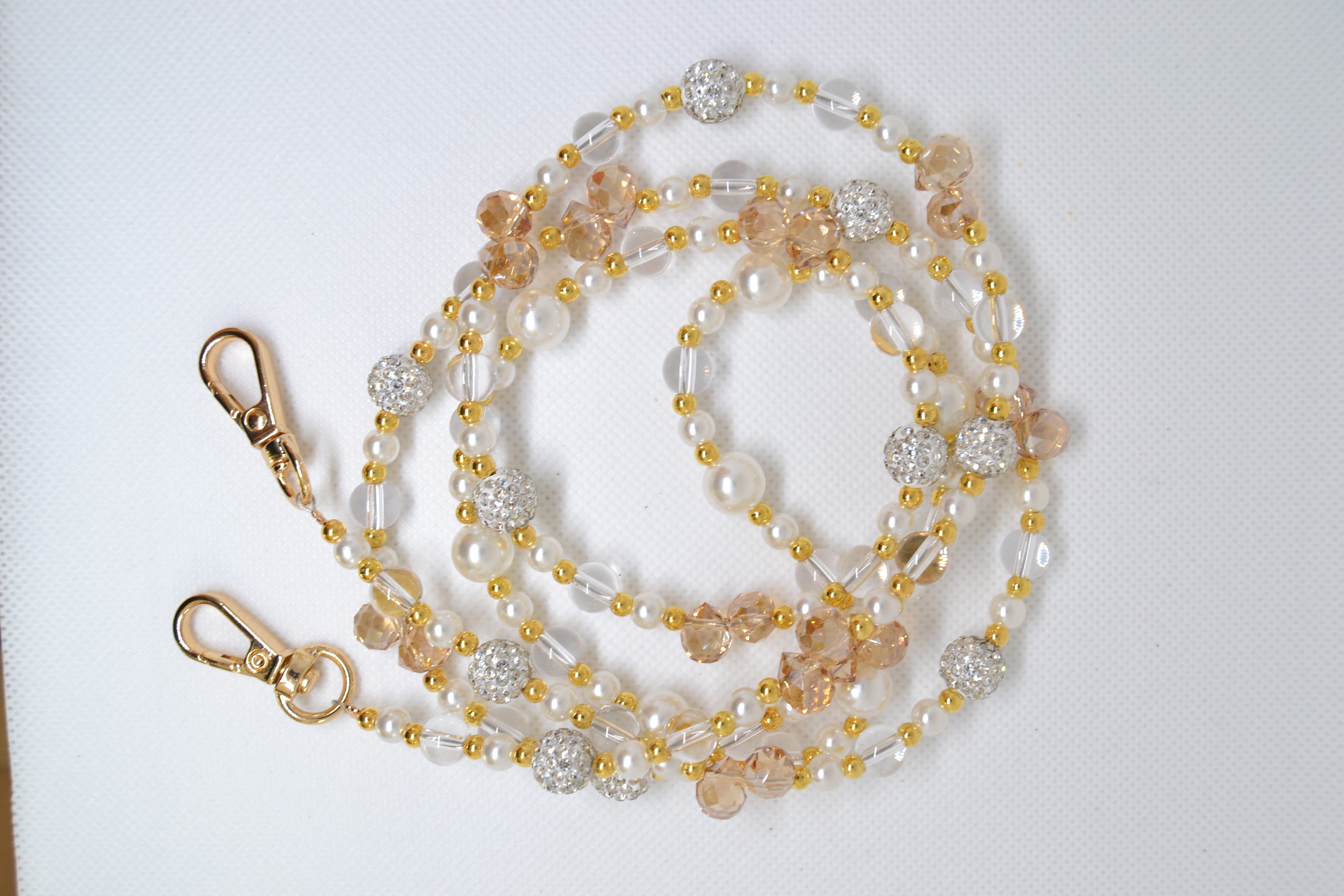 Žėrintys karoliai telefonui