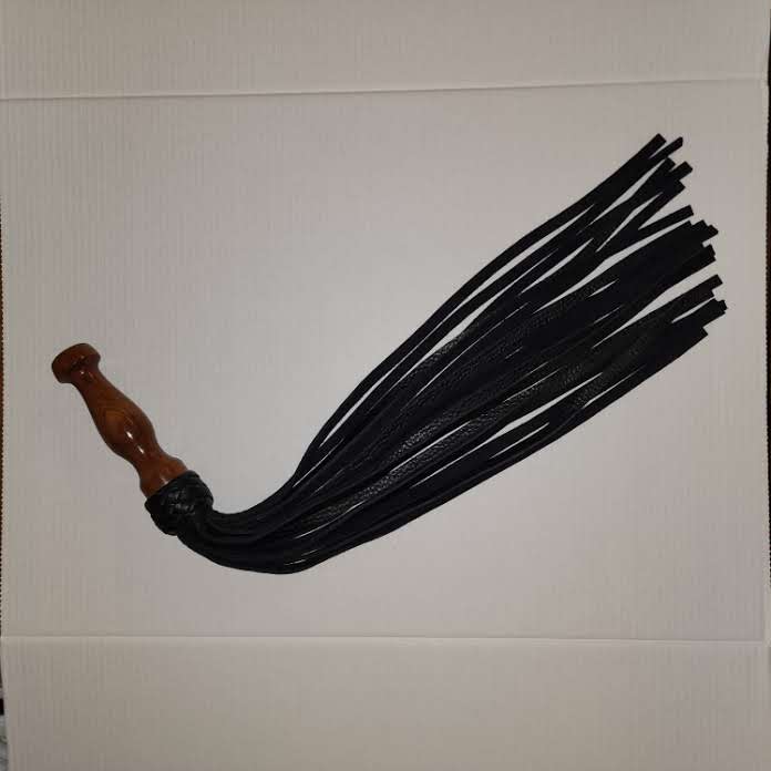 Black bullhide leather with a rosewood handle flogger
