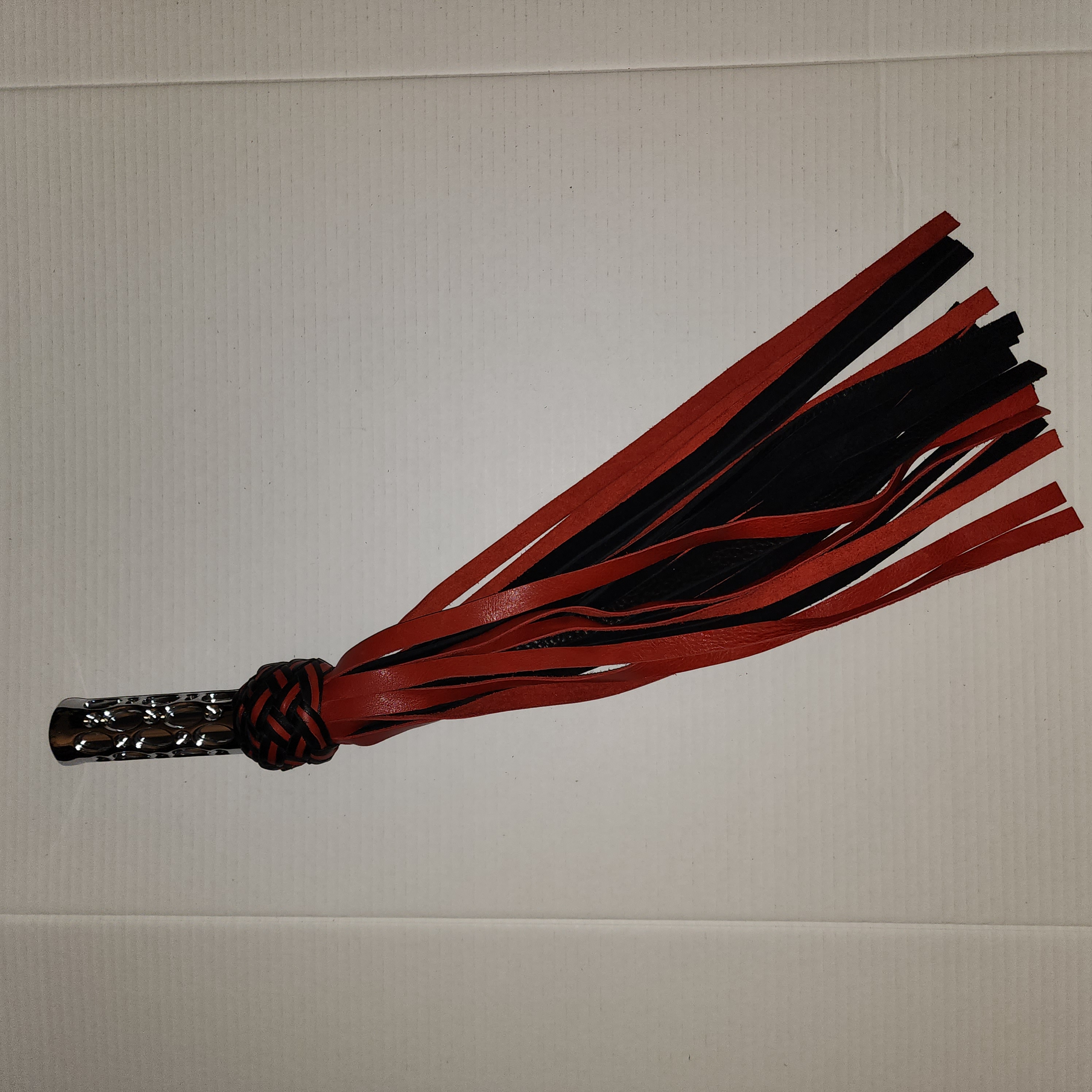 Aluminum motorcycle grip handled flogger with black bullhide leather and red motochap leather falls