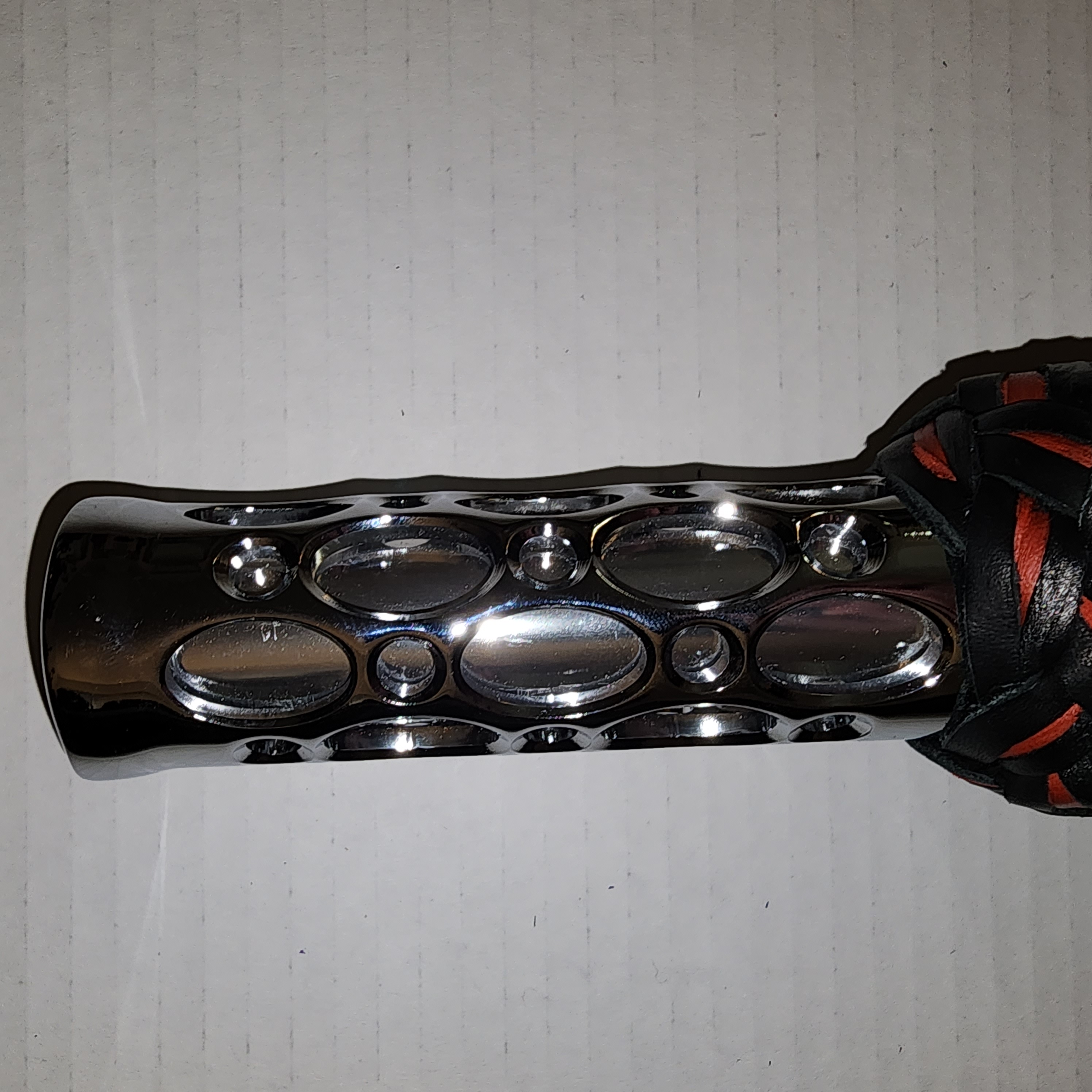 Aluminum motorcycle grip handled flogger with black bullhide leather and red motochap leather falls