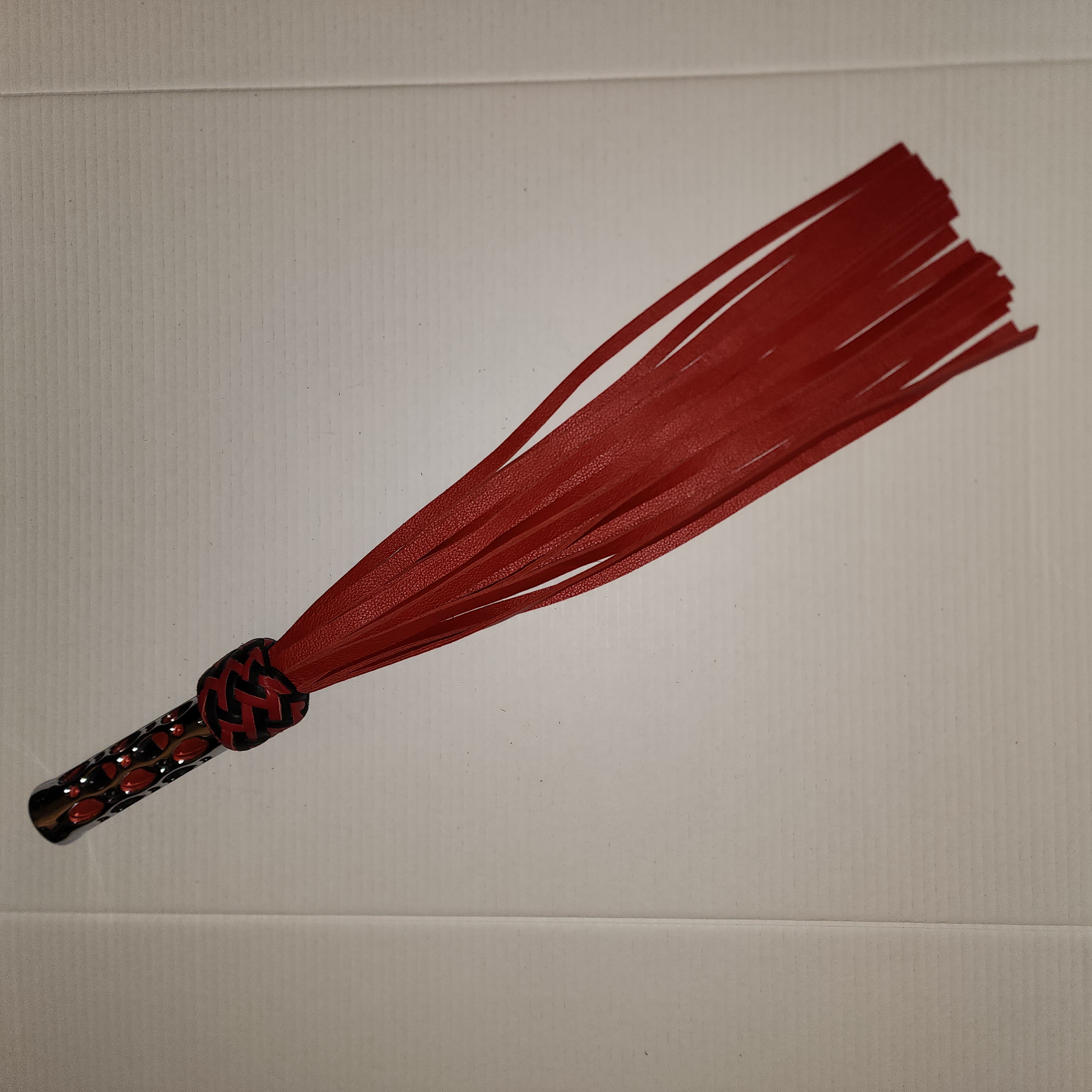 Aluminum motorcycle grip handled flogger braided with red and black leather and red motochap leather falls
