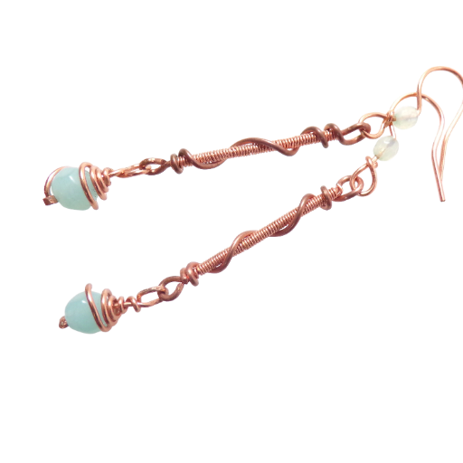 Baby Blue Copper Earrings. Dressy and sophisticated, these wire wrapped coils are accented with baby blue beads. Handmade in the USA.